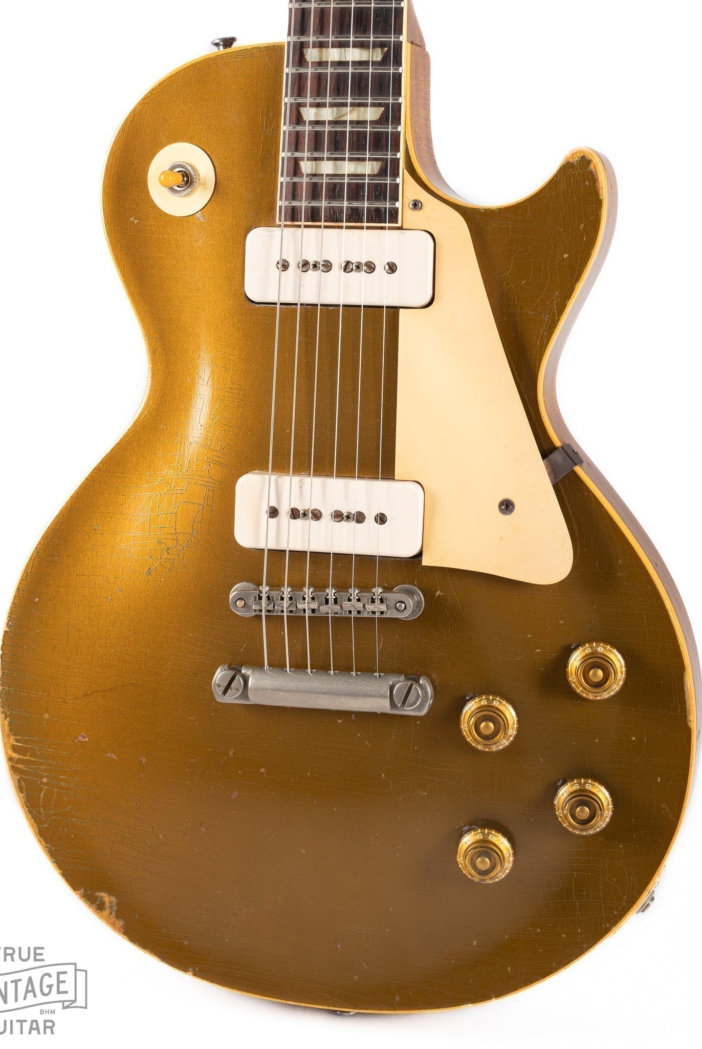 This image shows the body of a 1956 Gibson Les Paul Standard goldtop guitar. This page contains information about the history and value of these guitars.
