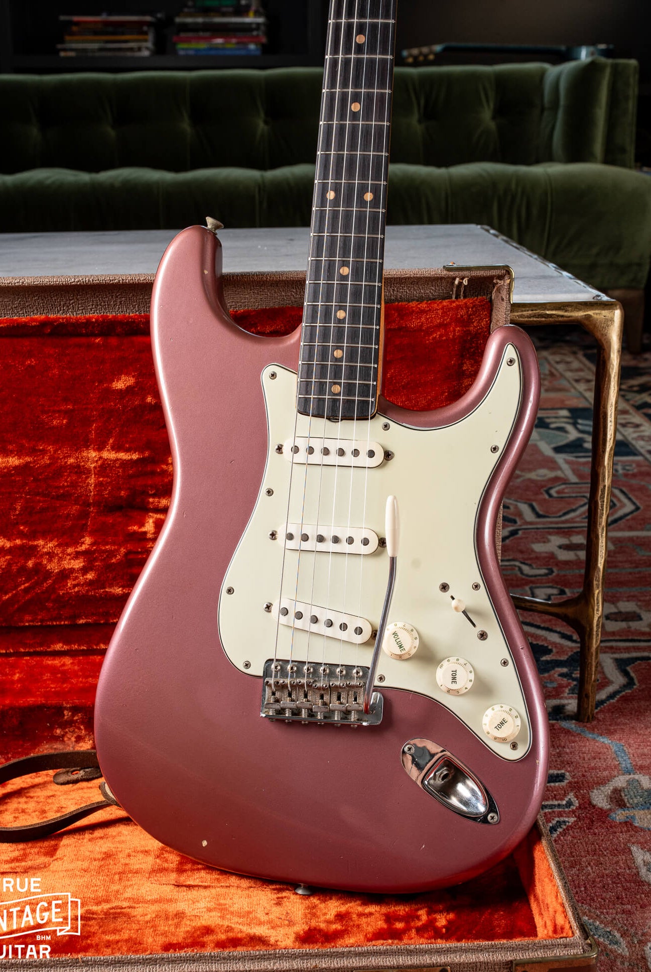 1963 Fender Stratocaster with Burgundy Mist finish, mint green pickguard, clay dots, and veneer Rosewood fretboard
