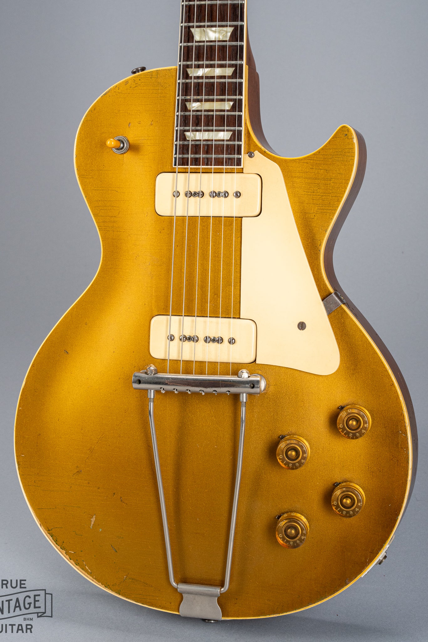 front of 1952 Gibson Les Paul Goldtop guitar body p90 pickups checking switch tip fretboard inlays binding trapeze tailpiece