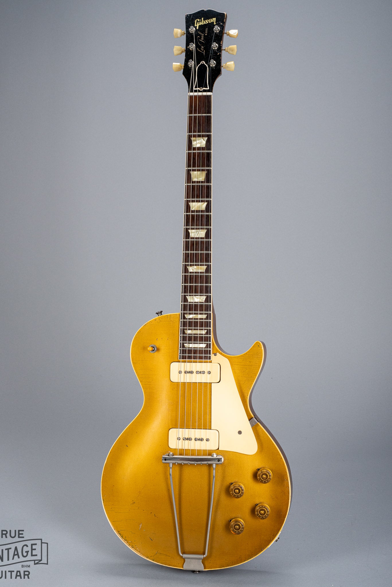 front of 1952 Gibson Les Paul Goldtop guitar body p90 pickups checking switch tip fretboard inlays binding neck and headstock