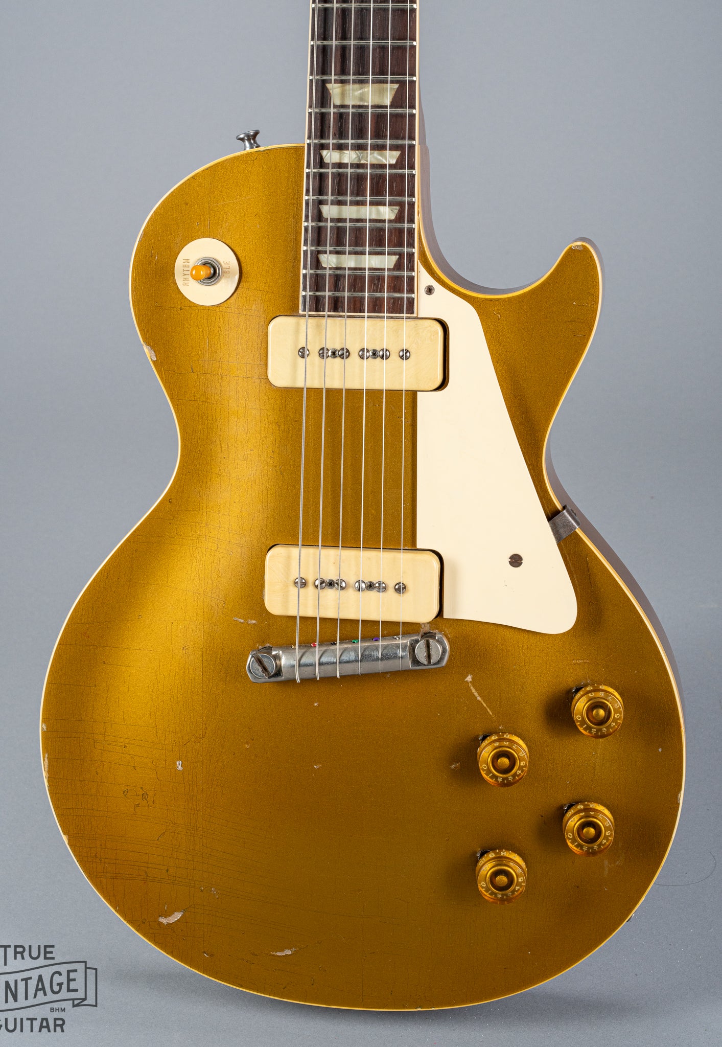 front of 1954 Gibson Les Paul Standard Goldtop guitar body p90 pickups checking switch tip fretboard inlays binding