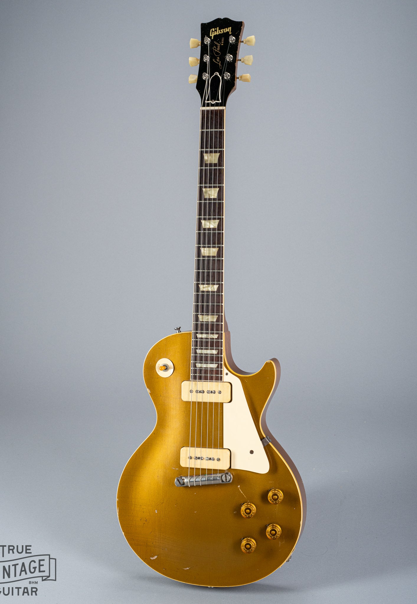 front of 1954 Gibson Les Paul Standard Goldtop guitar body p90 pickups checking switch tip fretboard inlays binding headstock neck logo