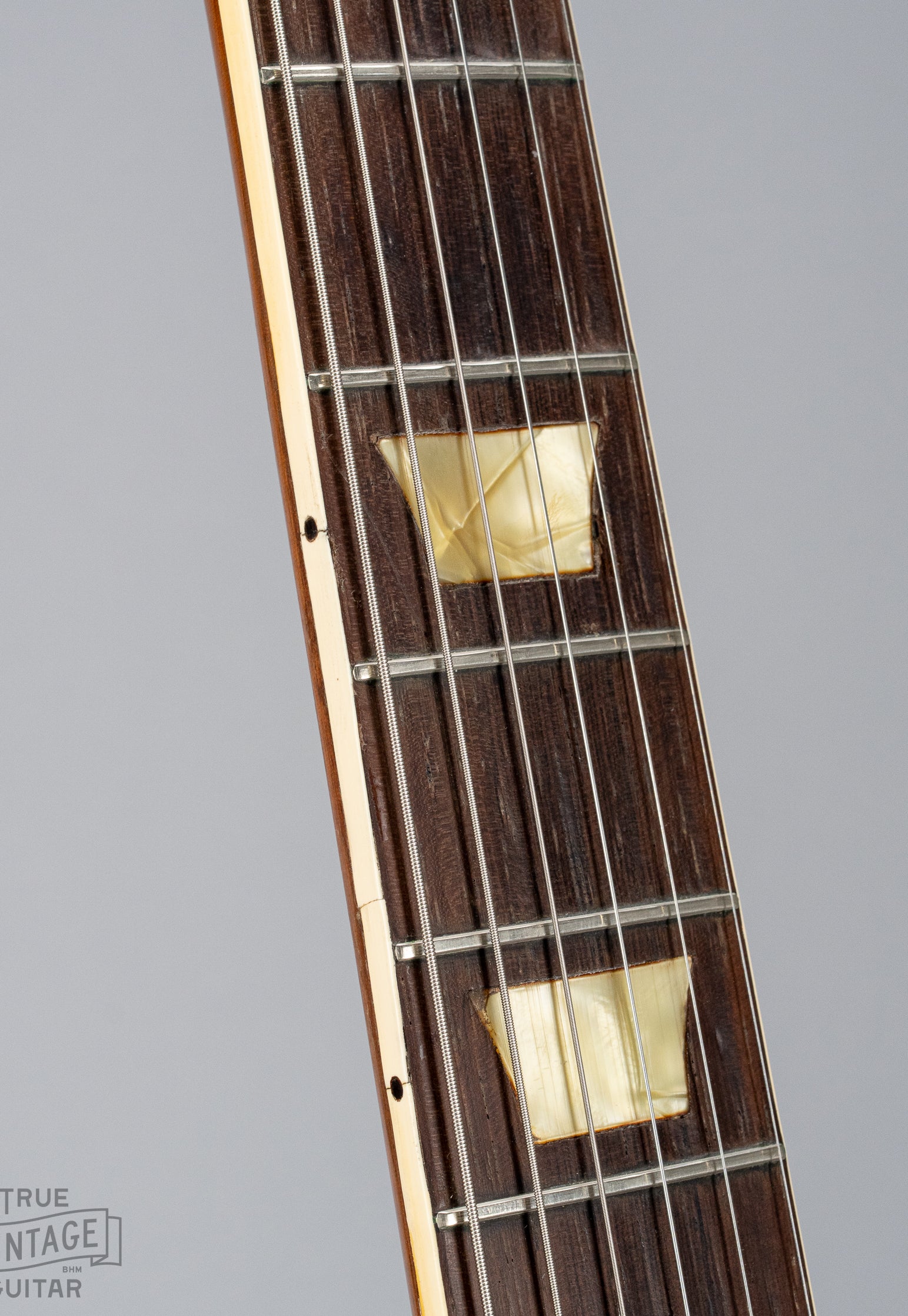 This image shows the neck binding of a 1954 Gibson Les Paul goldtop guitar