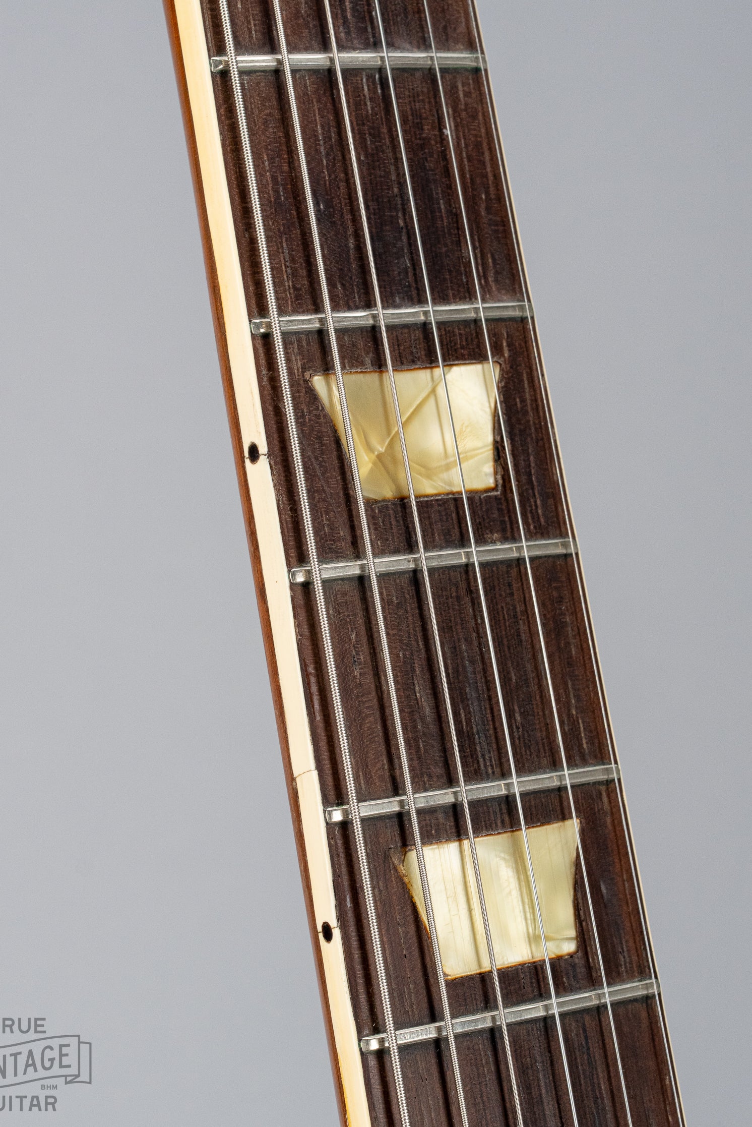 This image shows the neck binding of a 1954 Gibson Les Paul goldtop guitar