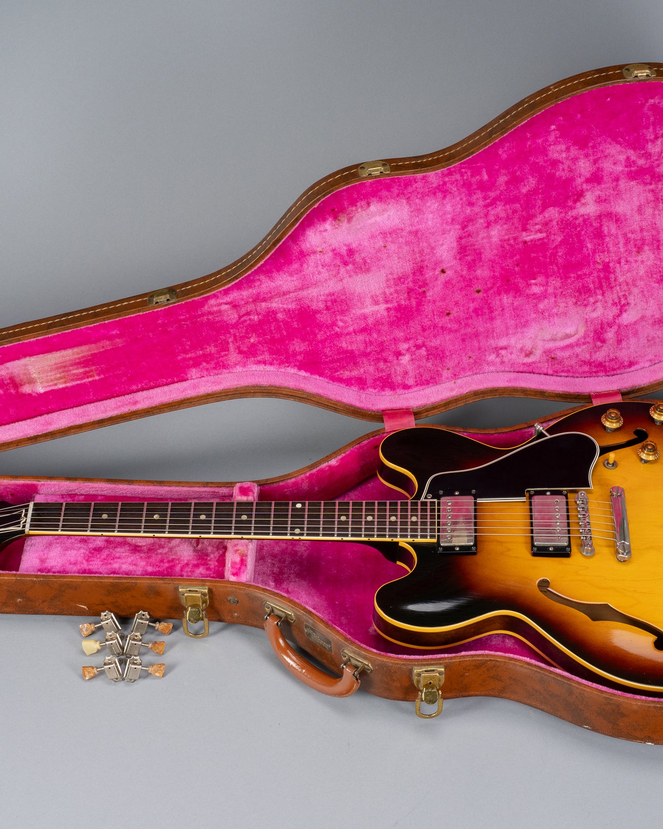Landscape photo of 1959 Gibson ES-335 in original pink lined Lifton hardshell case