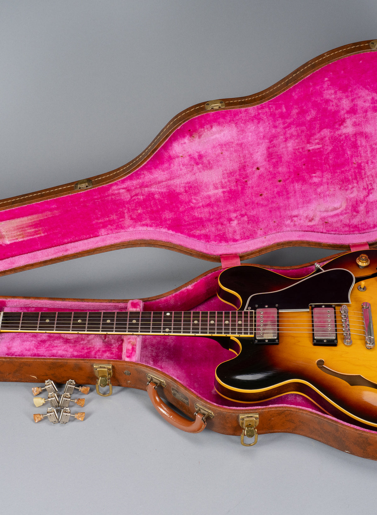 Landscape photo of 1959 Gibson ES-335 in original pink lined Lifton hardshell case