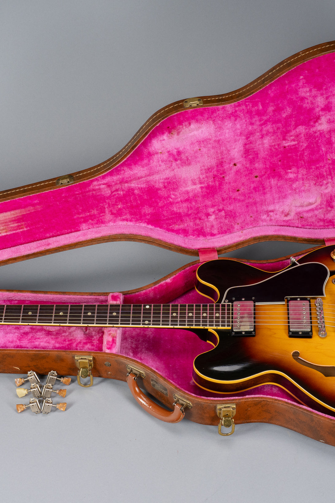 Landscape photo of 1959 Gibson ES-335 in original pink lined Lifton hardshell case