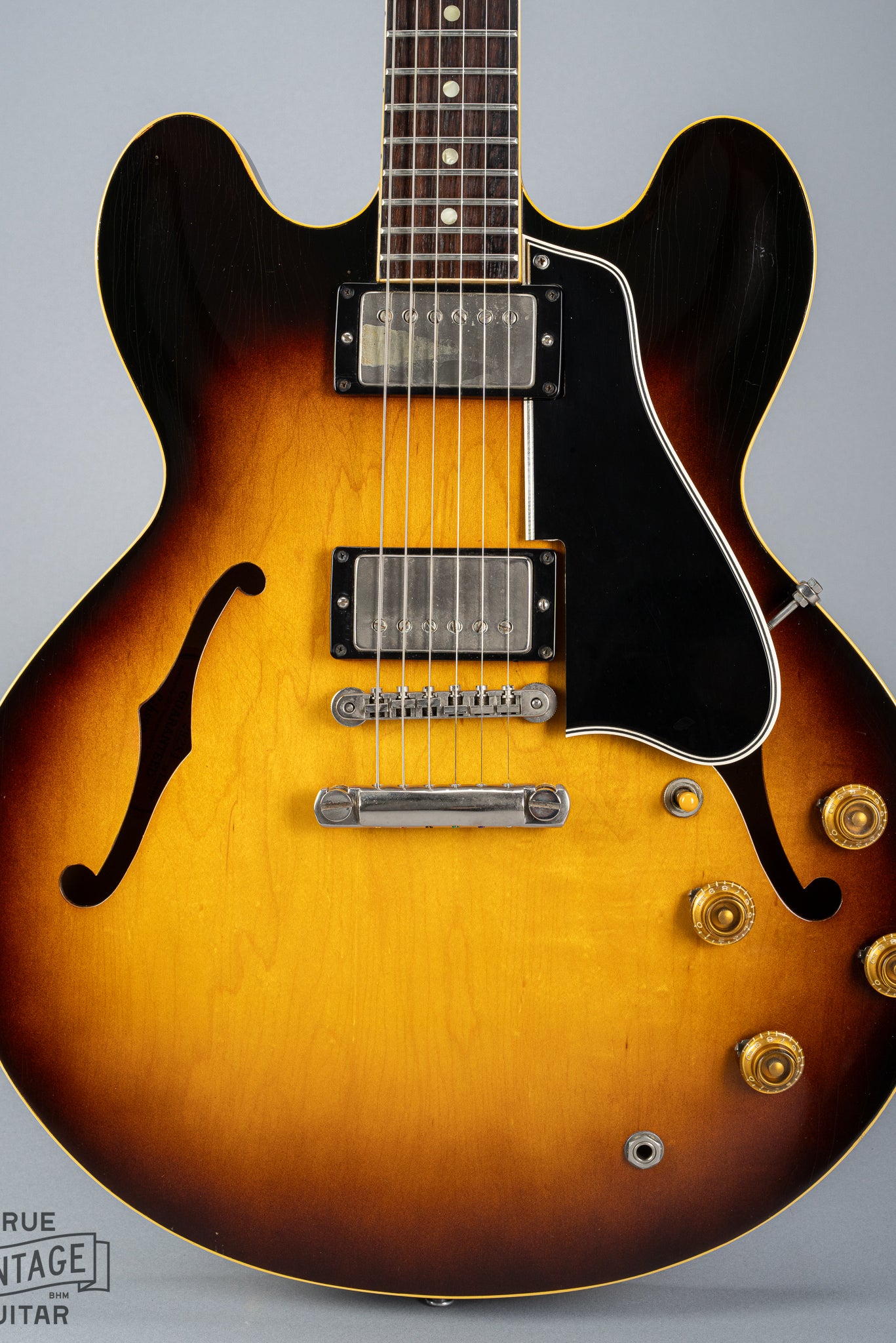 This image shows the front of the body of a 1959 Gibson ES-335 vintage guitar in original Sunburst finish with stop bar tailpiece.