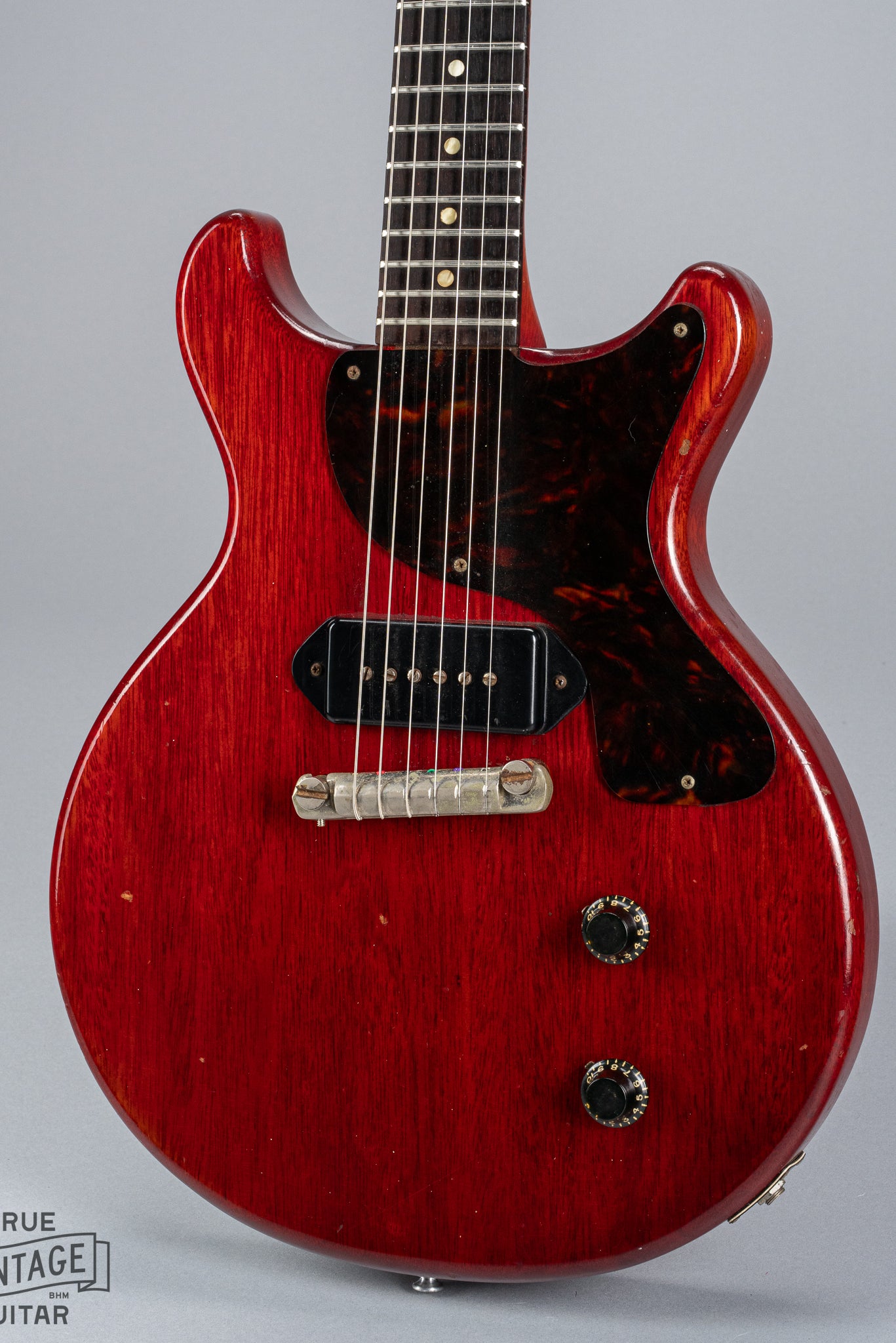 Front of 1959 Gibson Les Paul Junior cherry guitar dog ear p90 pickup tortoise pickguard volume and tone controls wrap around tail piece bridge fretboard original frets inlays