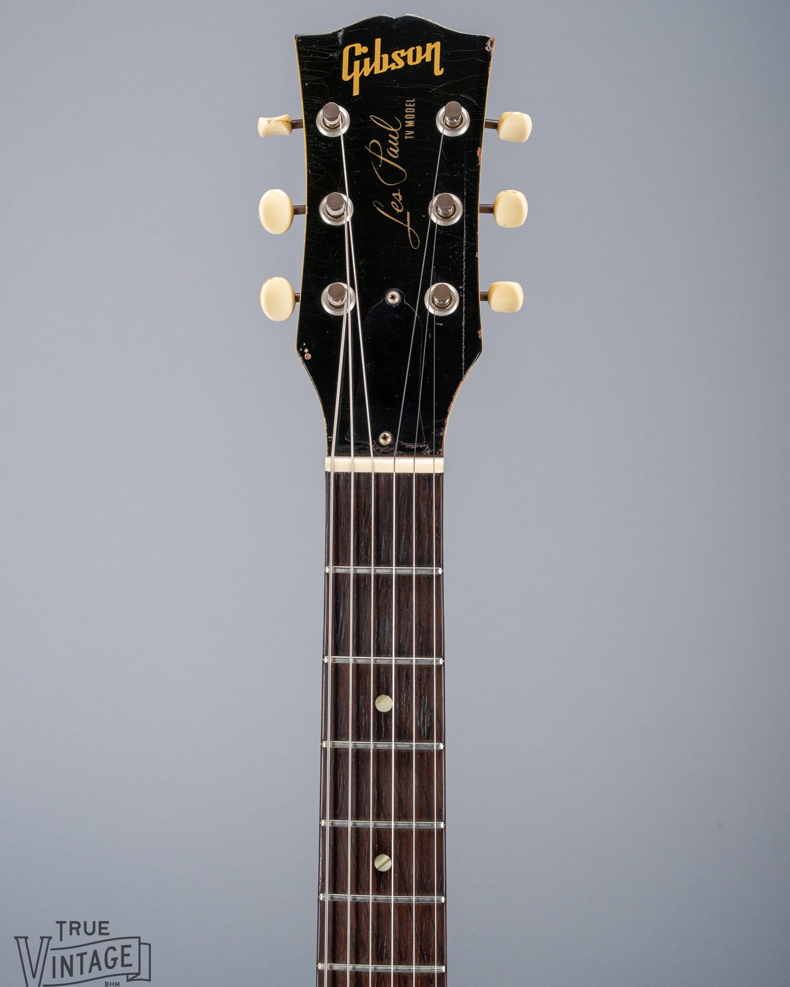 Front of 1959 Gibson Les Paul TV Model headstock, Logo, TV yellow, tuning machines, tuner buttons, neck, fretboard