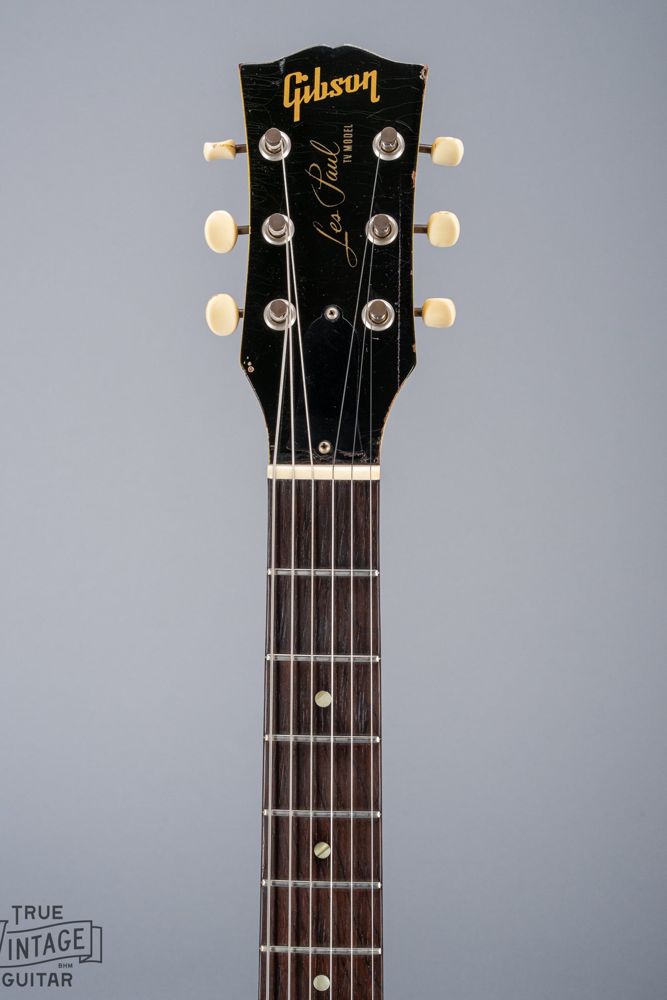 Front of 1959 Gibson Les Paul TV Model headstock, Logo, TV yellow, tuning machines, tuner buttons, neck, fretboard