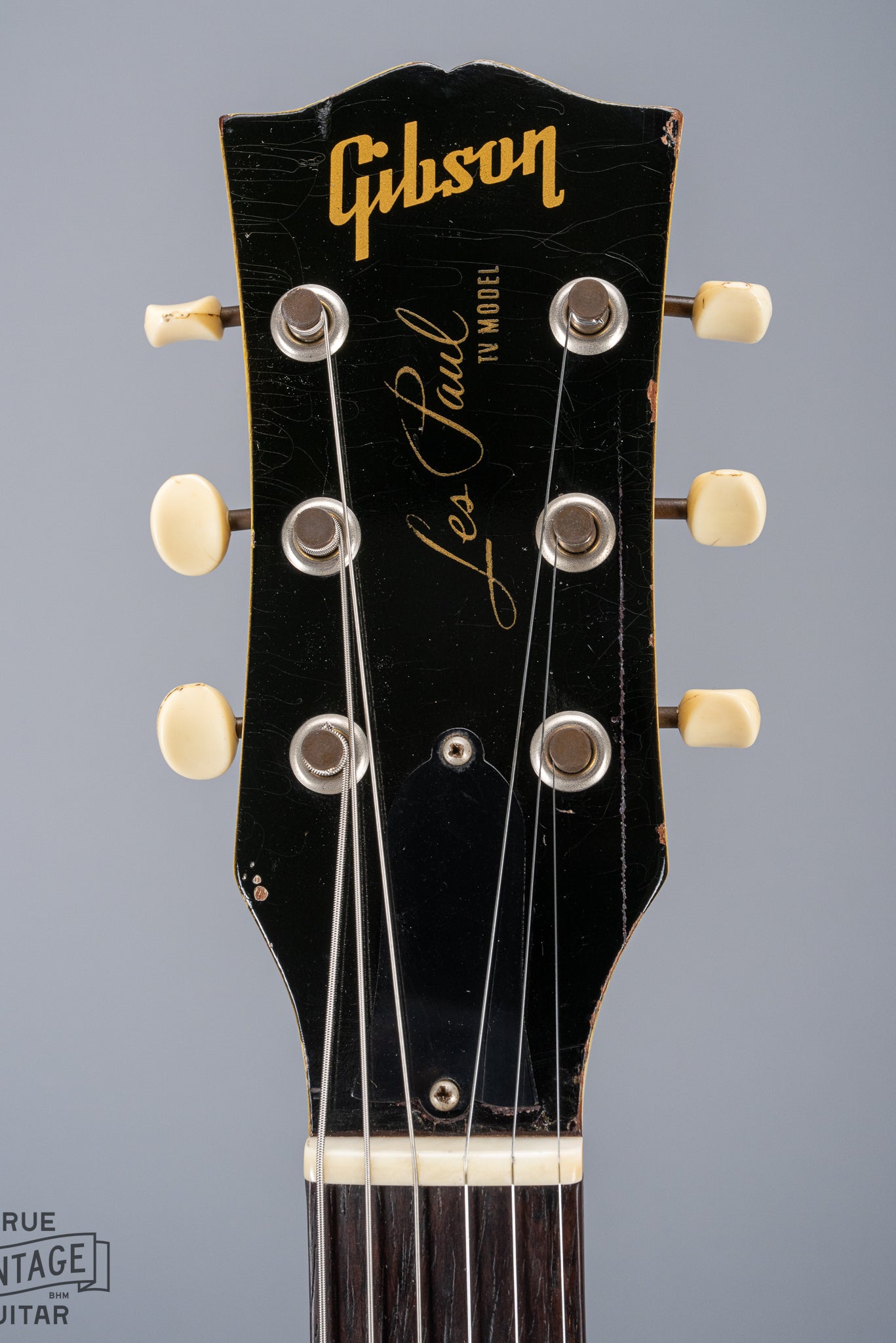 Front of 1959 Gibson Les Paul TV Model headstock, Logo, TV yellow, tuning machines, tuner buttons