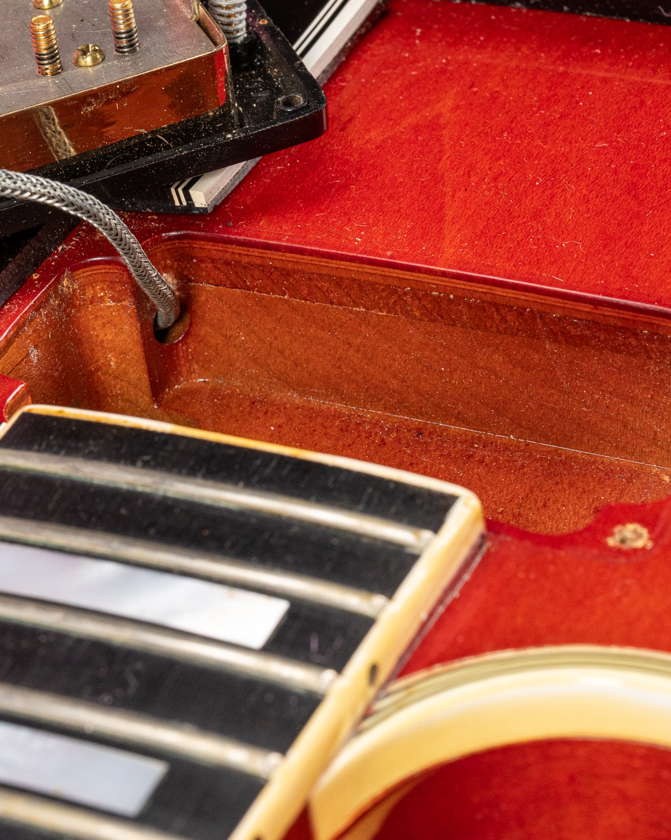 Thin top view from the neck pickup cavity showing solid Spruce layer