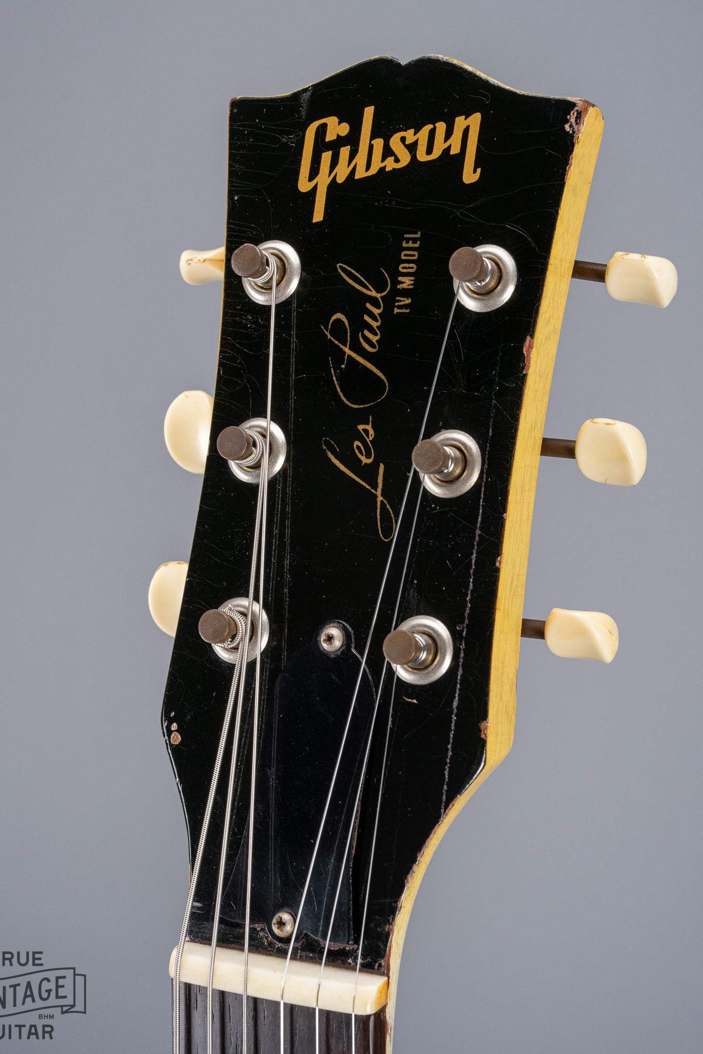 Front of 1959 Gibson Les Paul TV Model headstock, Logo, TV yellow, tuning machines, tuner buttons