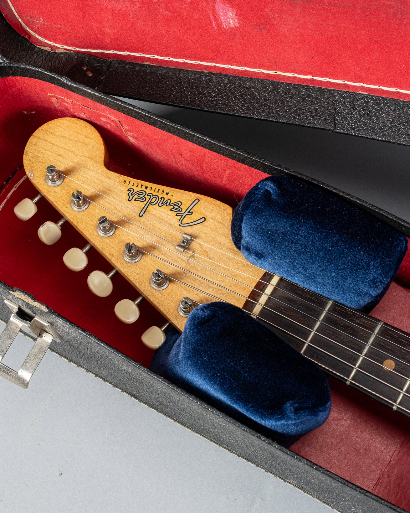 Front of 1960 Fender Musicmaster desert sand guitar body headstock fretboard hardshell case