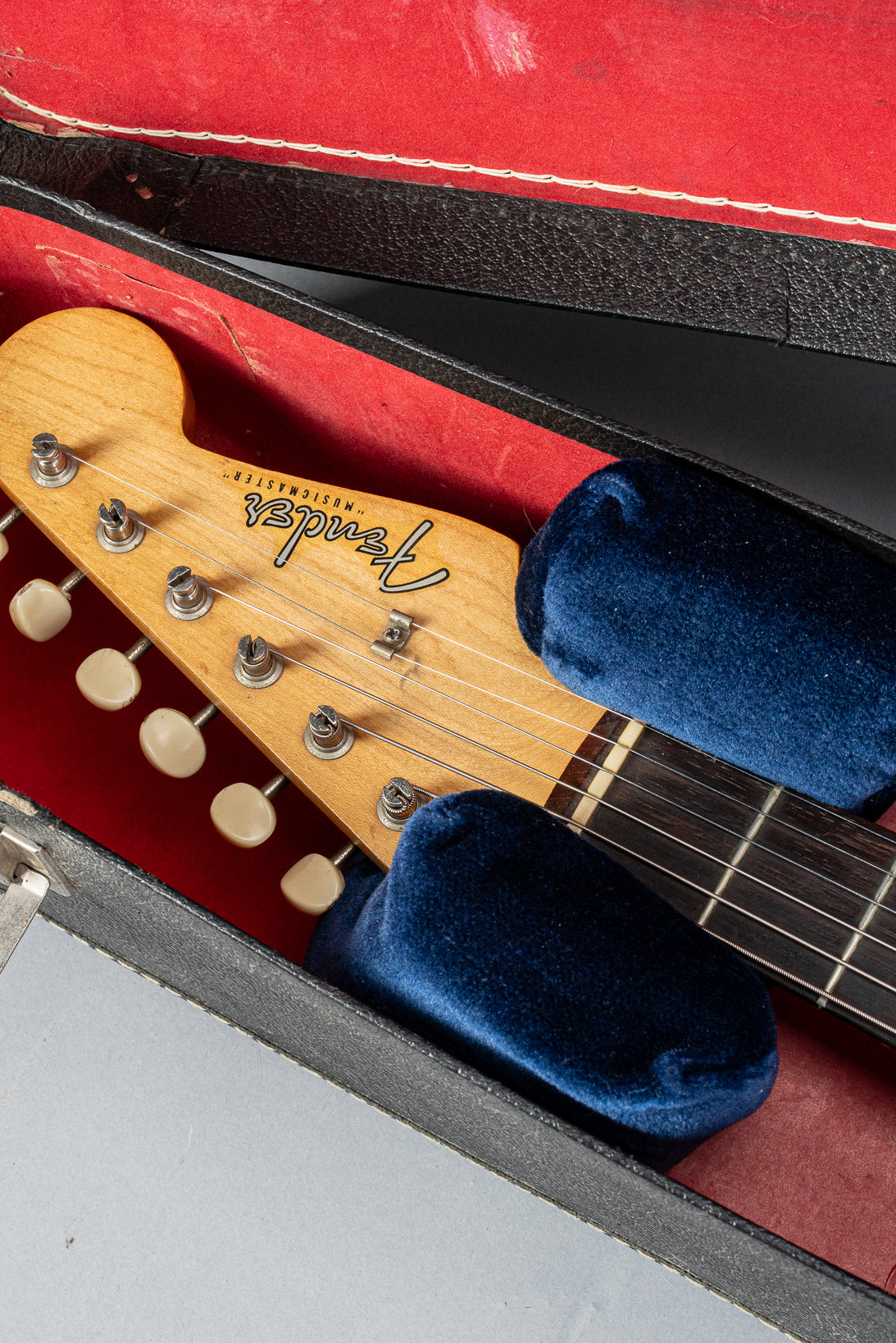 Front of 1960 Fender Musicmaster desert sand guitar body headstock fretboard hardshell case