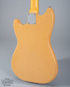 Back of 1960 Fender Musicmaster desert sand guitar body neck plate