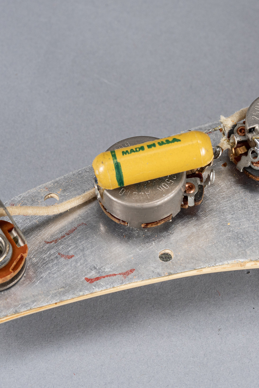 1960 Fender Musicmaster desert sand guitar electronics wiring under the pickguard pot codes