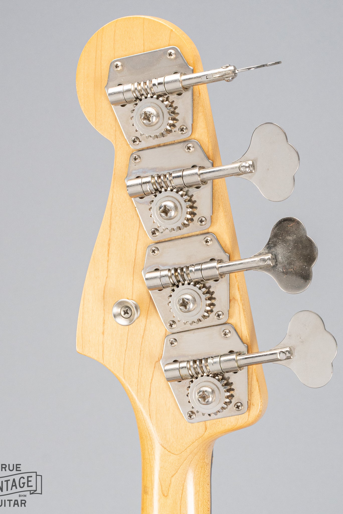 back of 1962 Fender Jazz Bass custom color black custom color guitar headstock and tuning machines