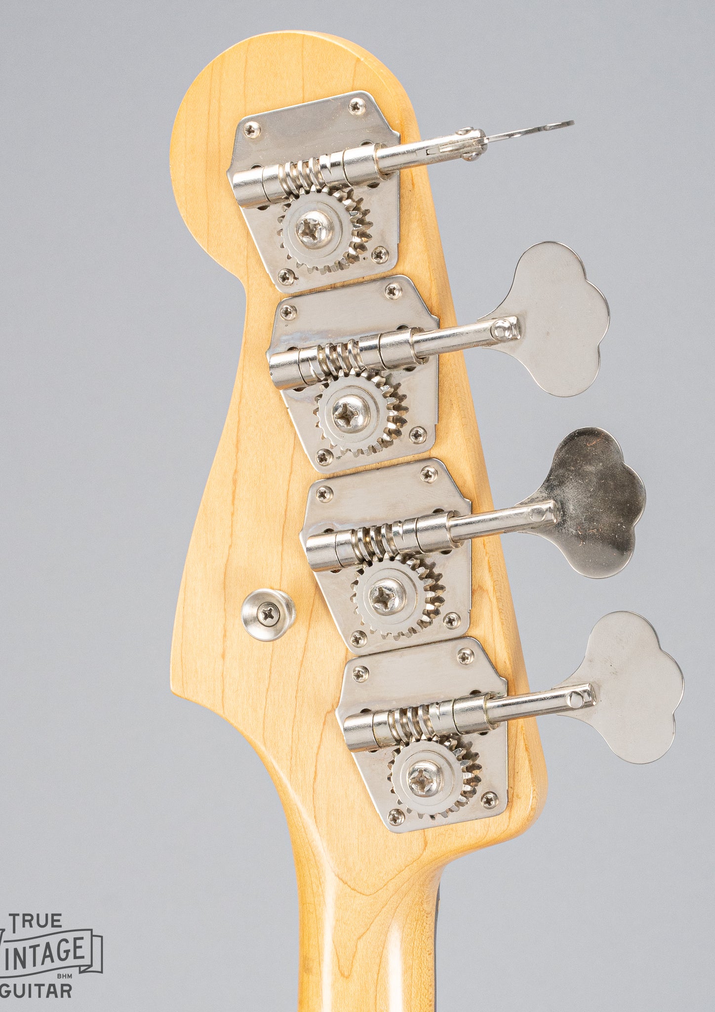 back of 1962 Fender Jazz Bass custom color black custom color guitar headstock and tuning machines