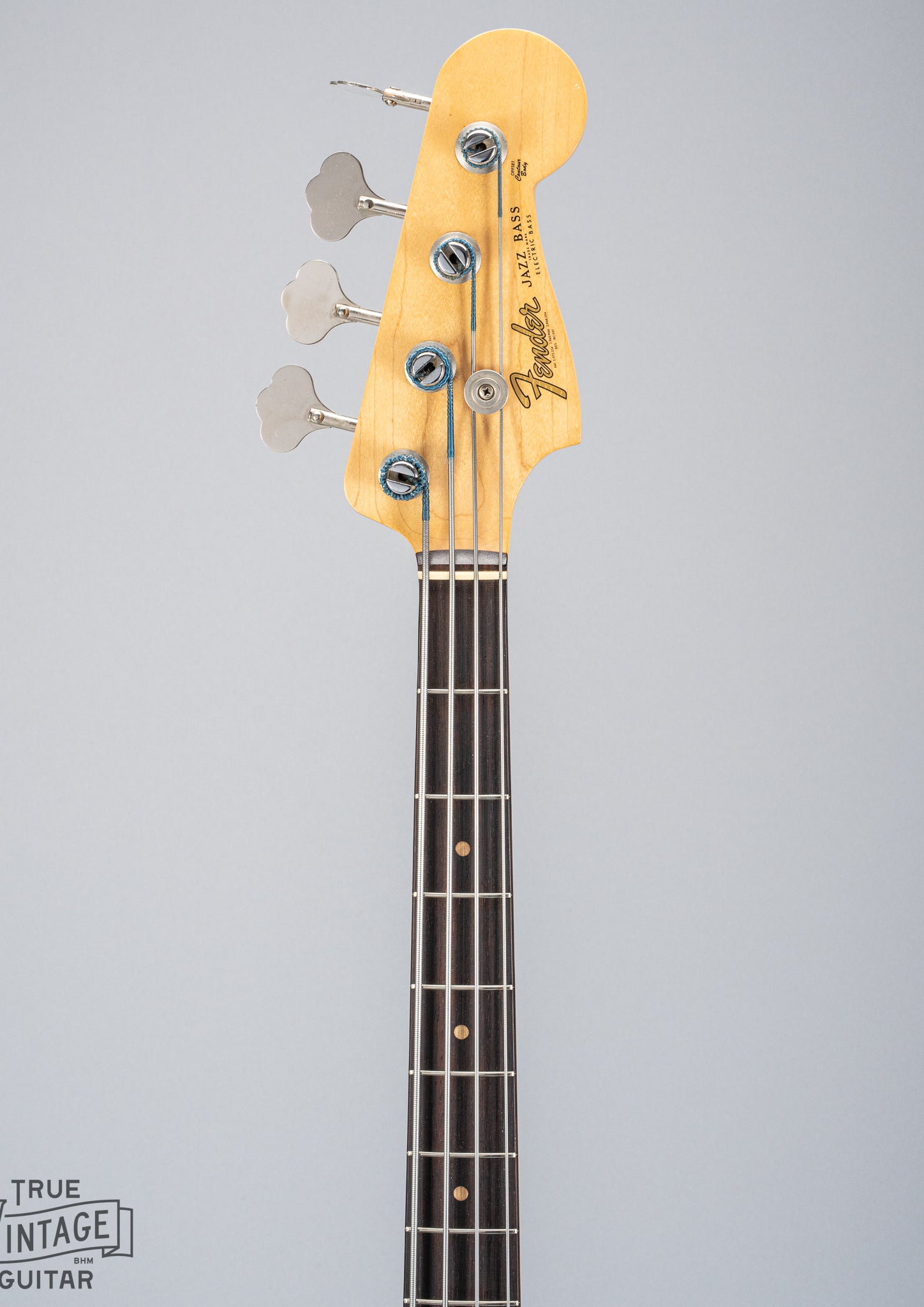Front of 1962 Fender Jazz Bass custom color black custom color guitar neck and headstock tuners