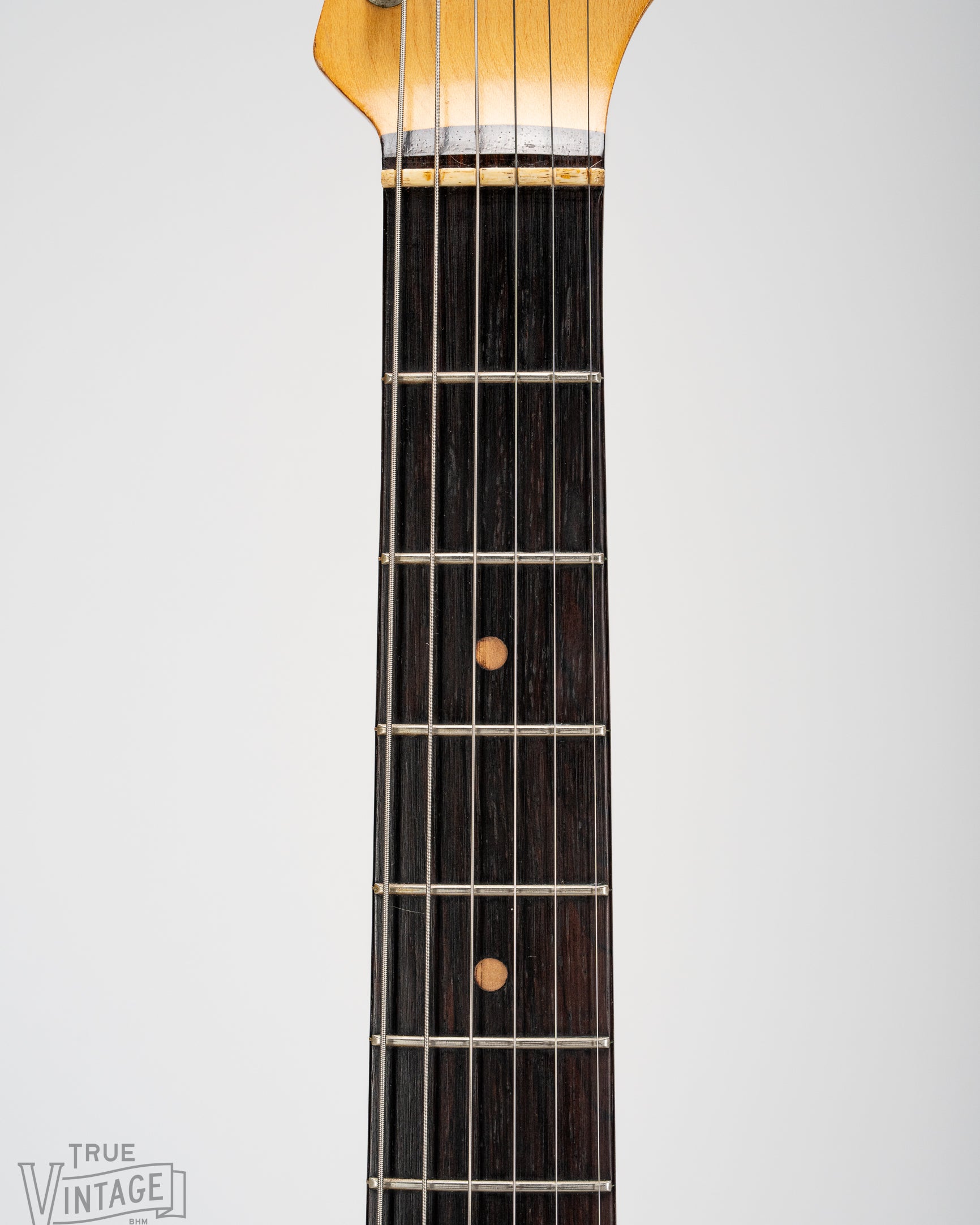 Brazilian Rosewood fretboard with clay dot markers