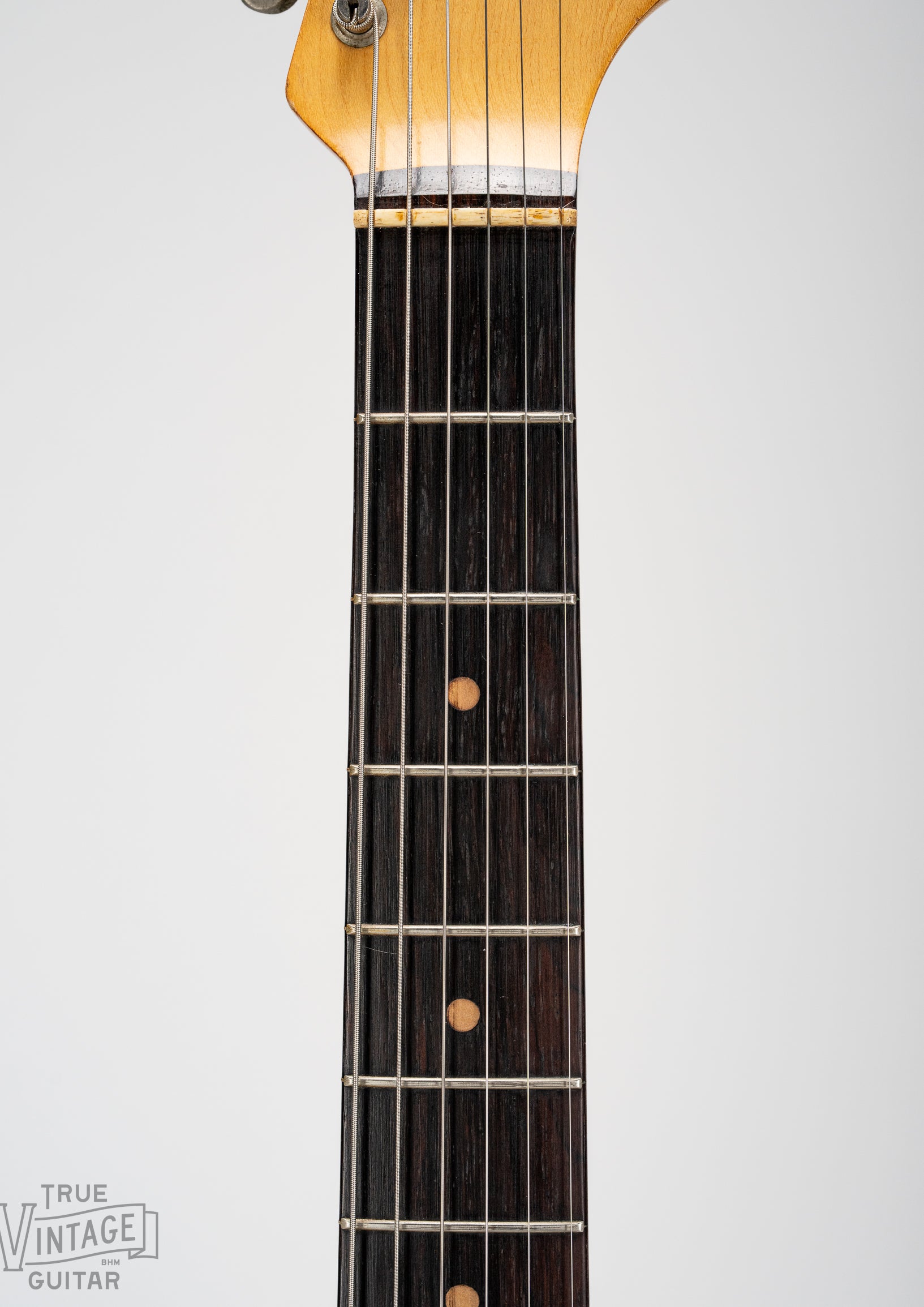 Brazilian Rosewood fretboard with clay dot markers