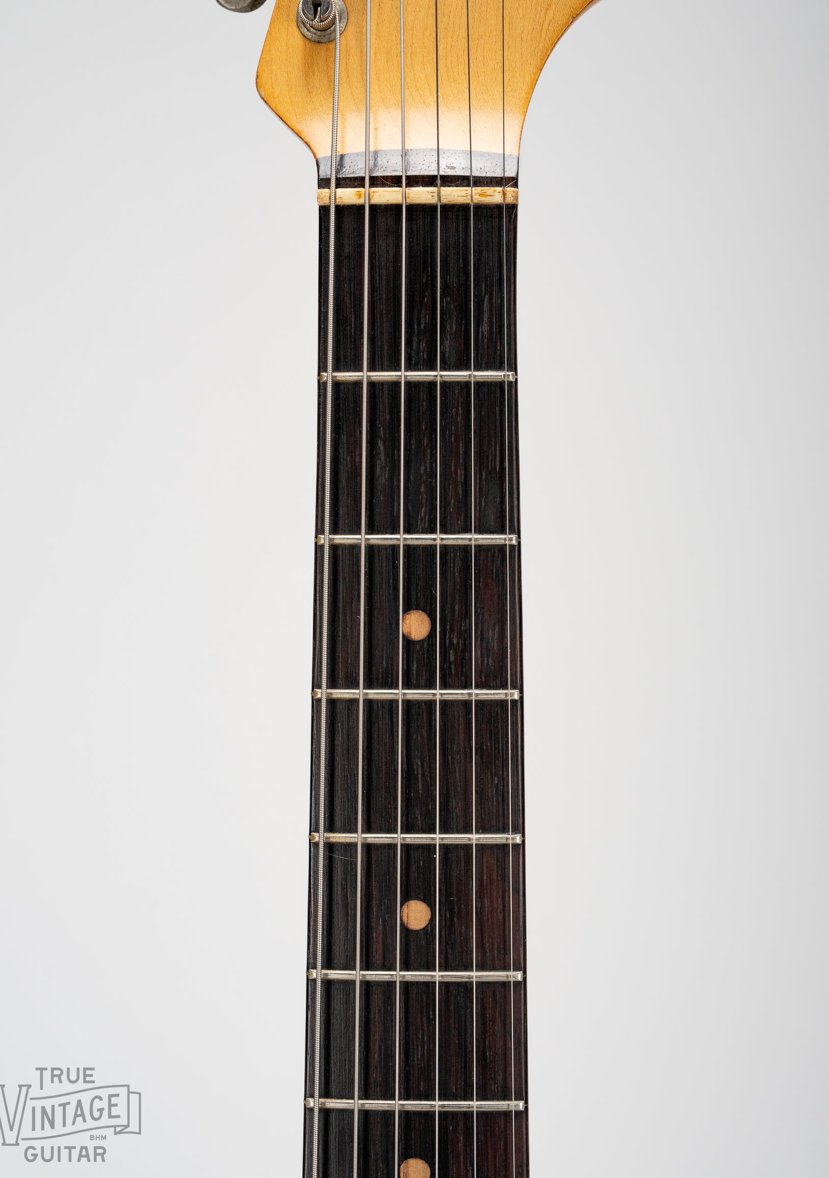 Brazilian Rosewood fretboard with clay dot markers