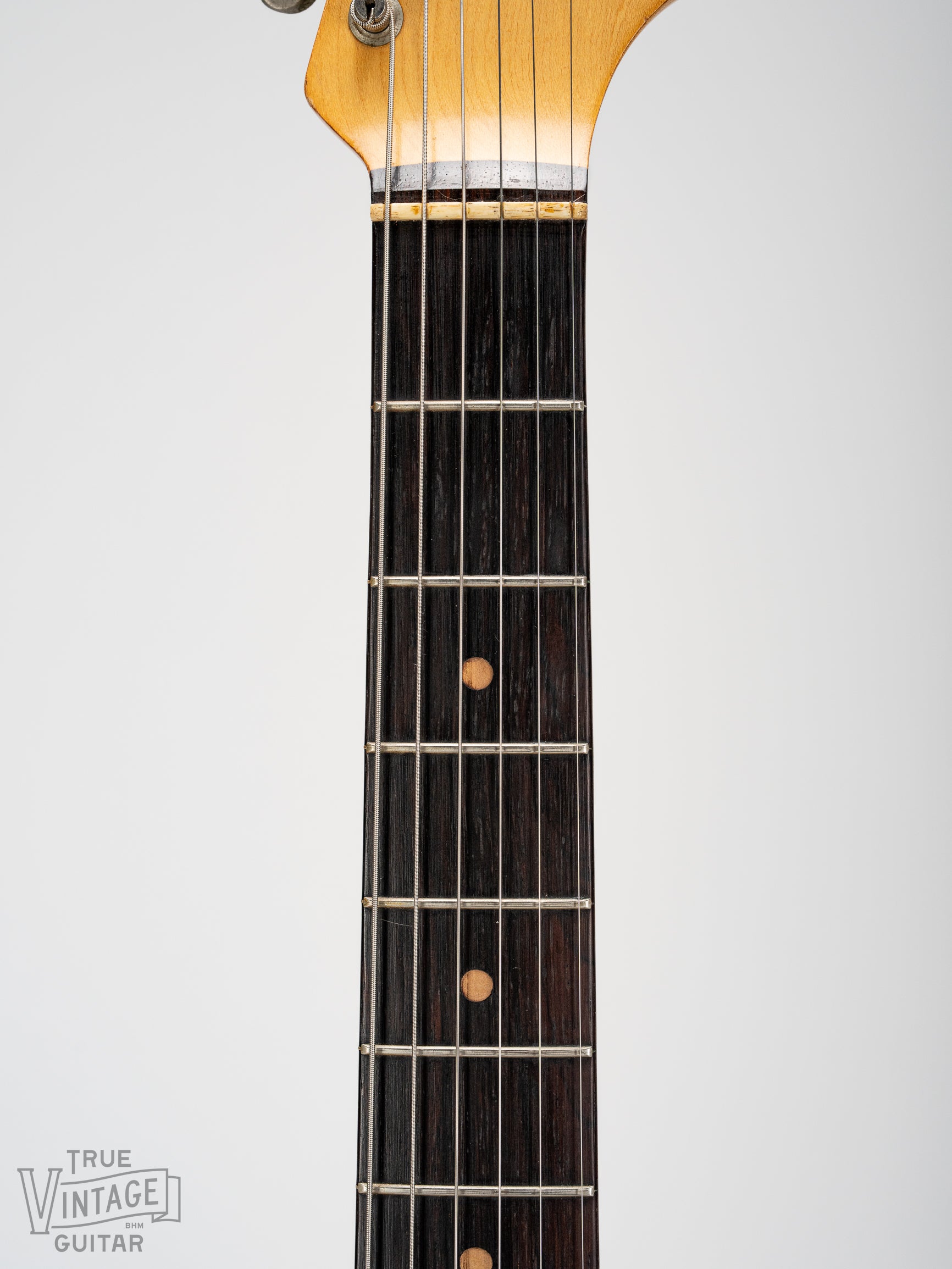 Brazilian Rosewood fretboard with clay dot markers