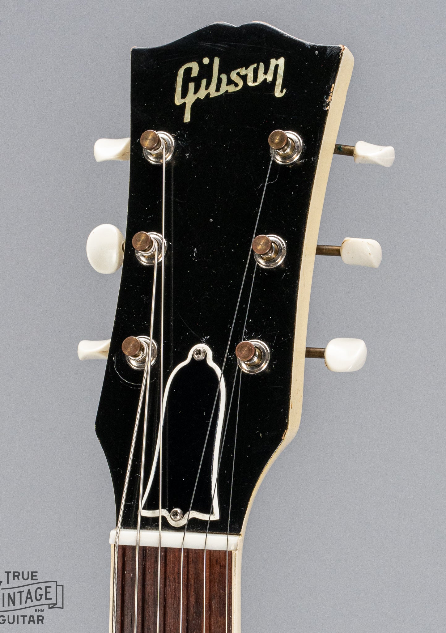 Front of 1962 Gibson SG Special white guitar headstock logo tuners