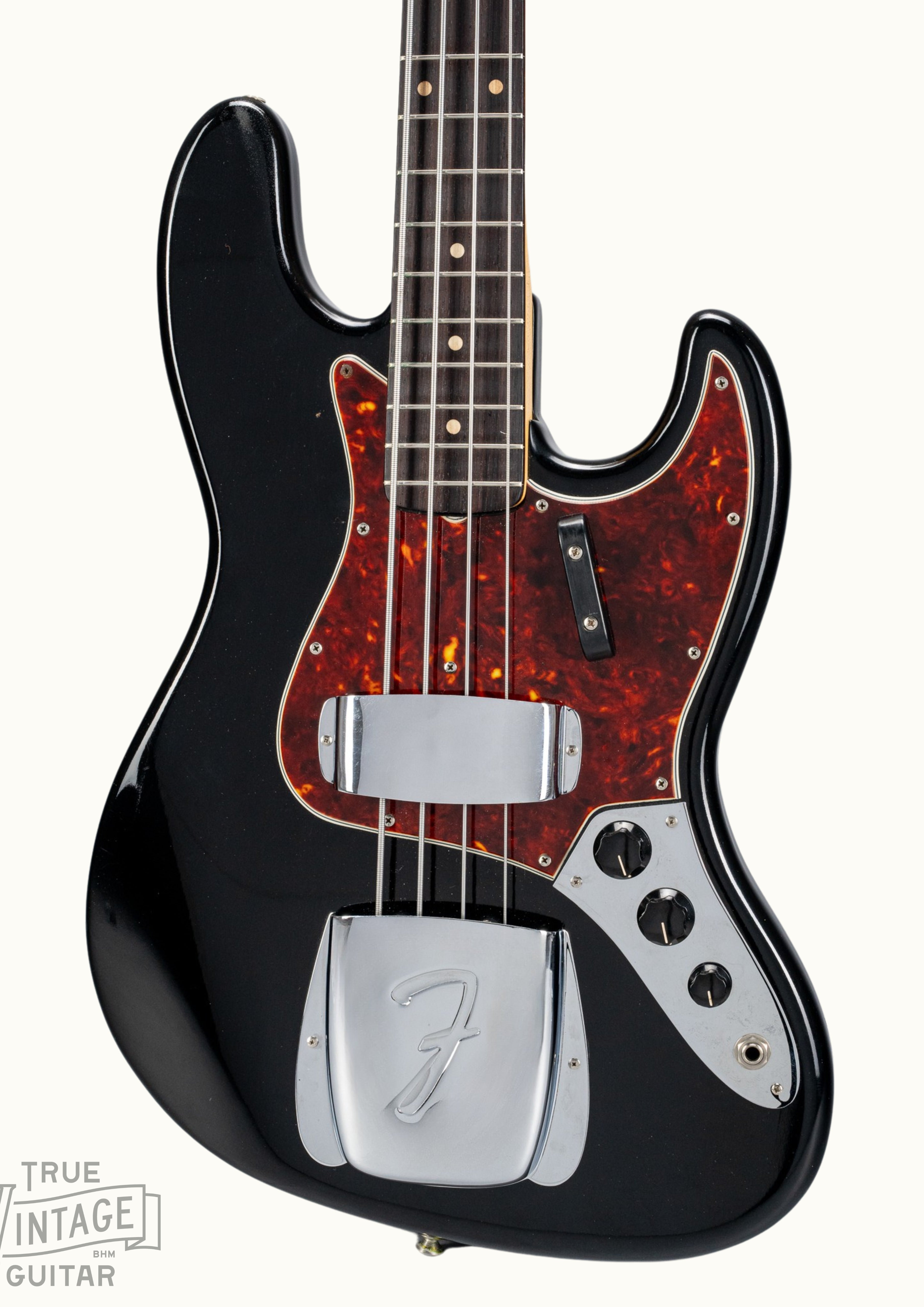 Front of 1962 Fender Jazz Bass custom color black custom color guitar tortoise shell pick guard