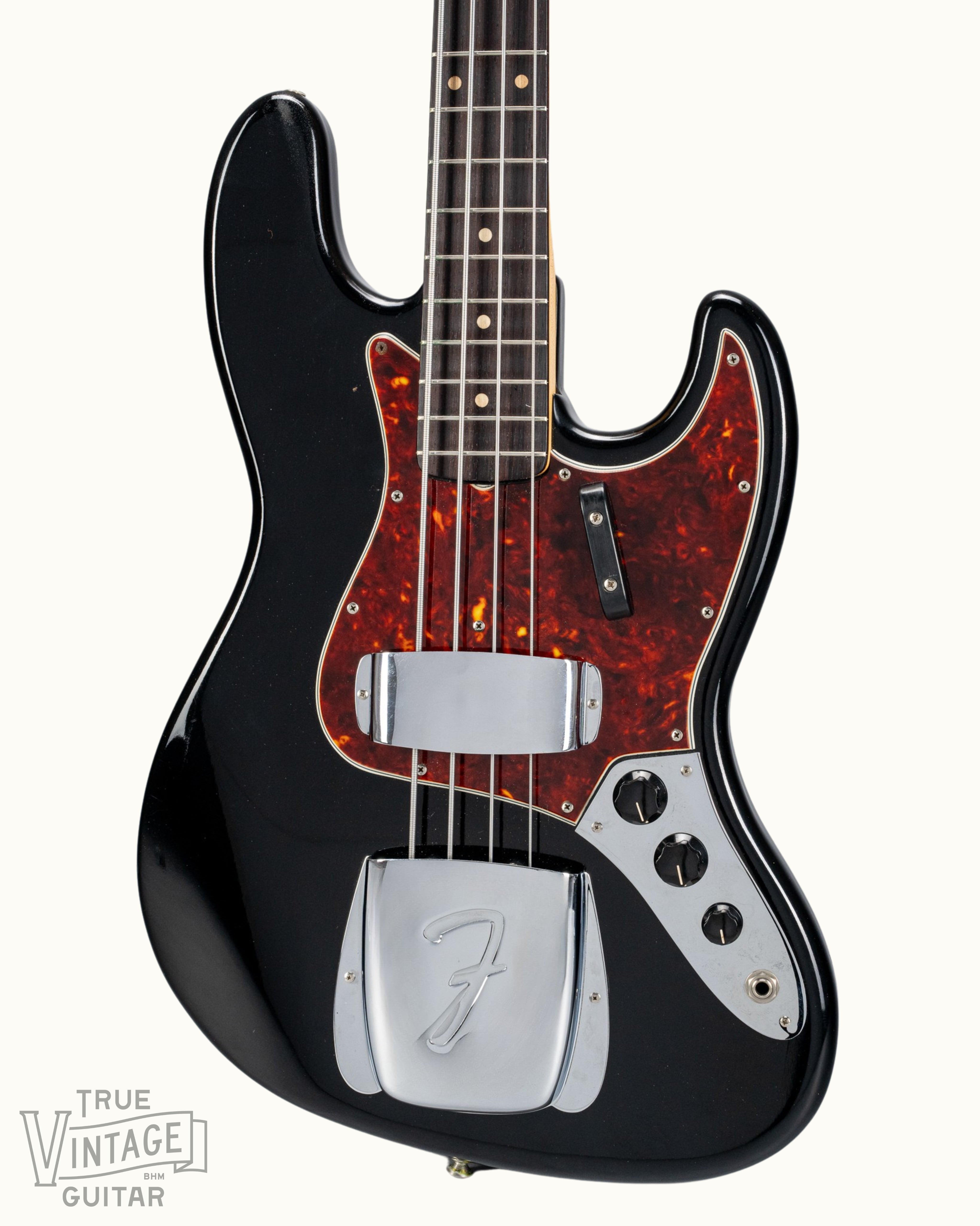 Front of 1962 Fender Jazz Bass custom color black custom color guitar tortoise shell pick guard