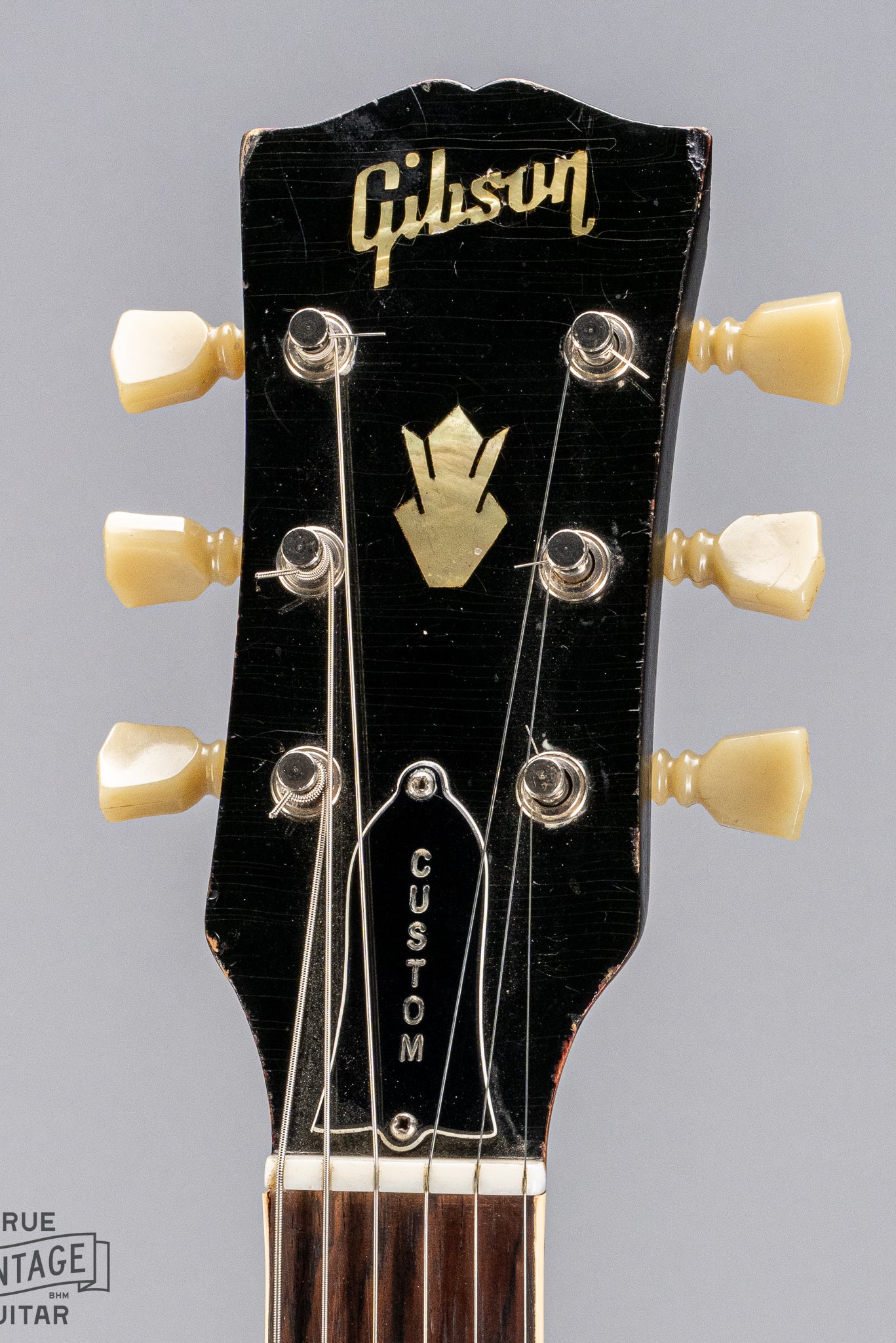 front of Gibson 1963 ES-335 Cherry red guitar Custom headstock and Gibson logo