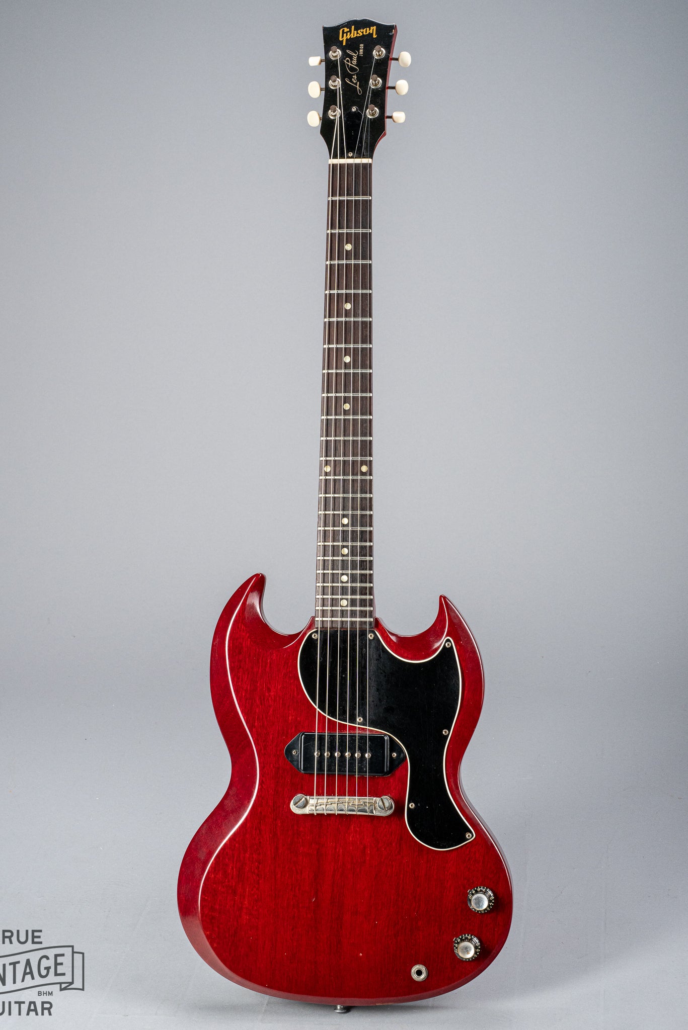 Front of Gibson Les Paul Junior Cherry red guitar P90 pickup neck headstock fretboard