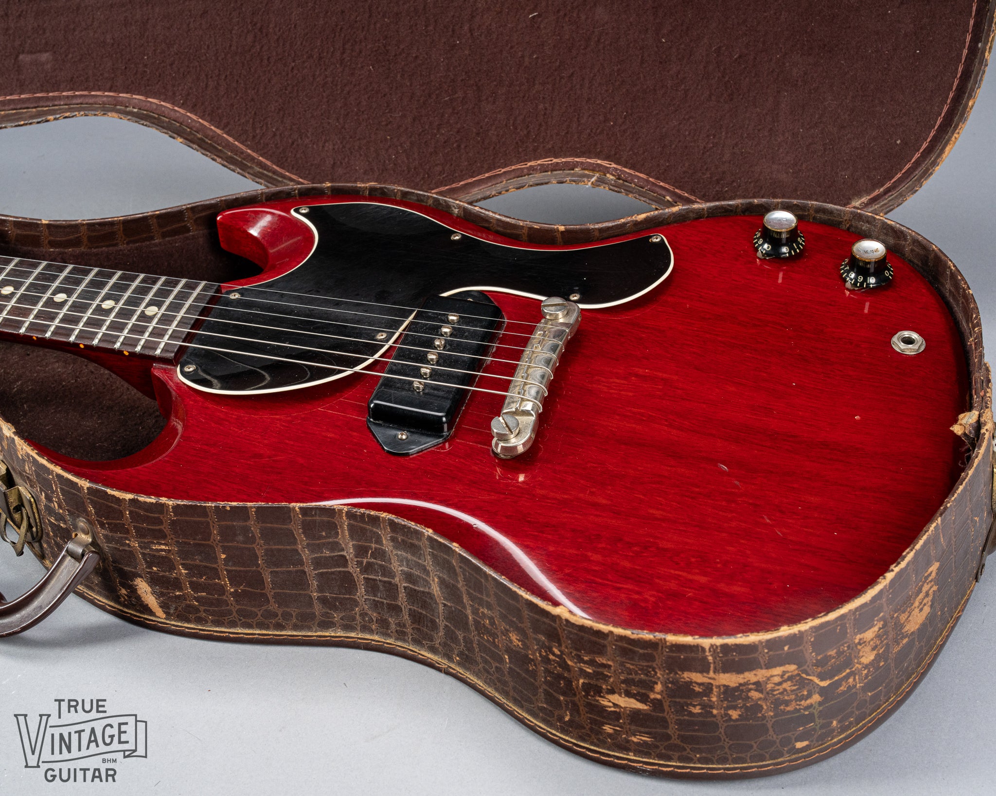 Front of Gibson Les Paul Junior Cherry red guitar body in original case