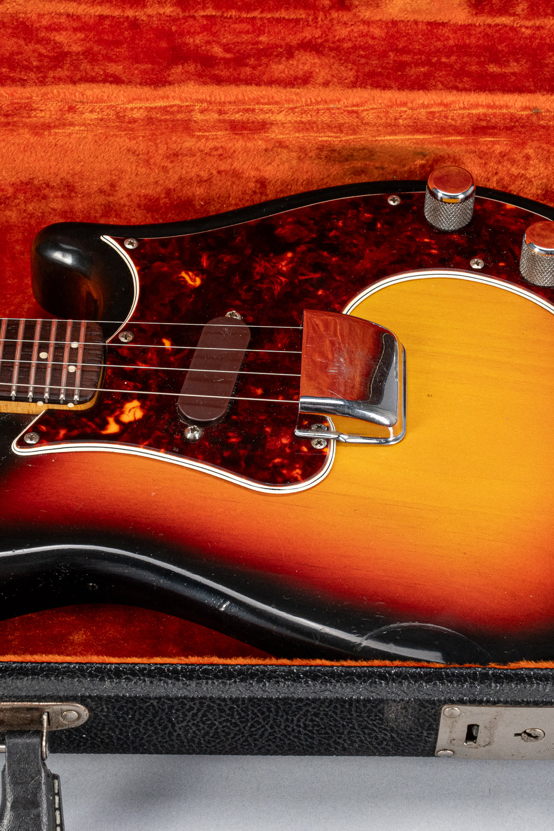 Front of 1965 Fender Electric Mandolin Sunburst guitar mandolin body in original case