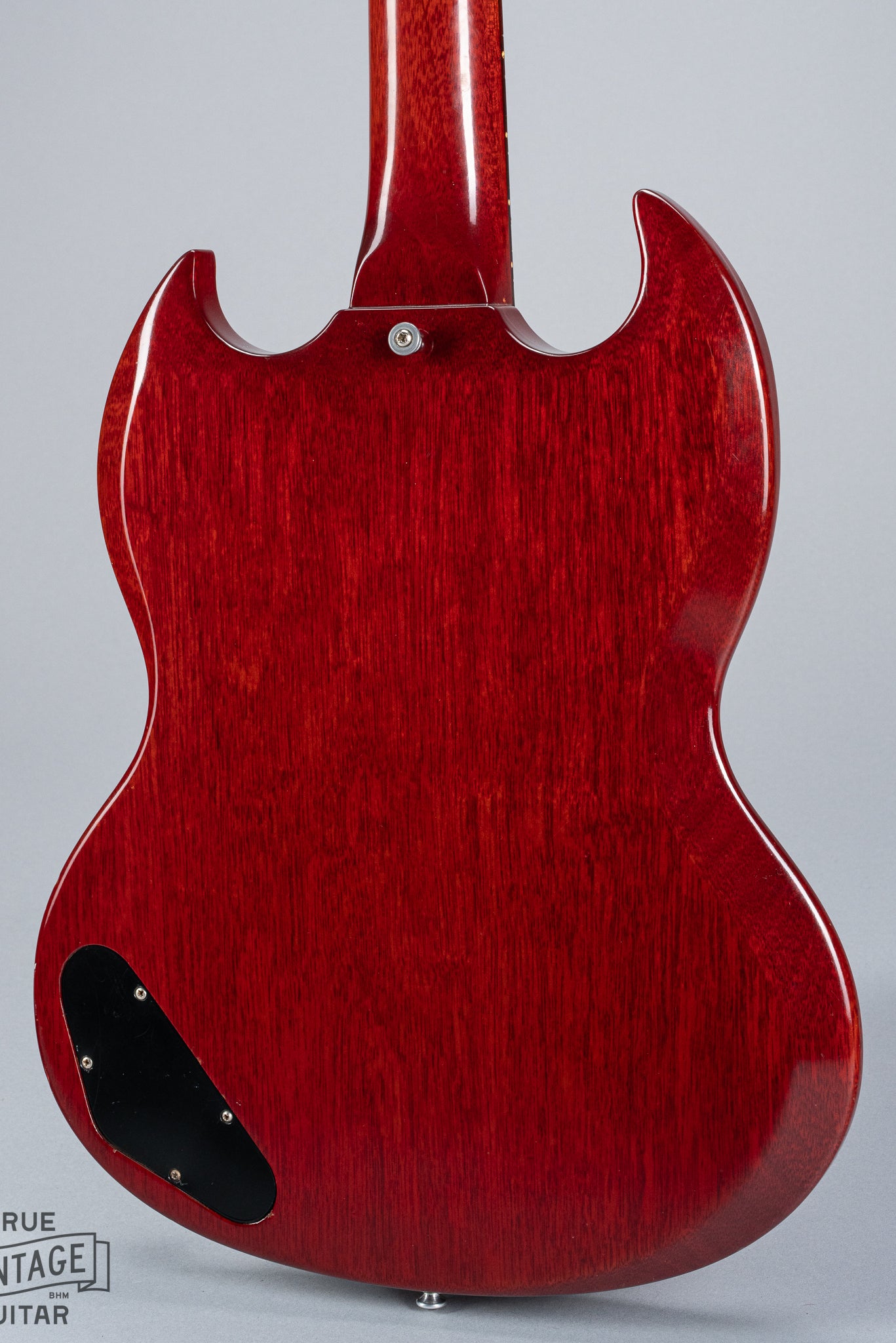 back of 1964 Gibson SG Junior Cherry guitar body pickguard dog ear P90 bridge wrap around tailpiece volume and tone controls fretboard original frets control cavity plate strap button