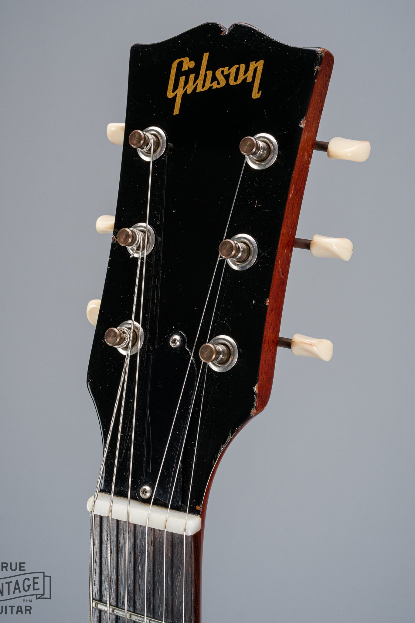 Front of 1964 Gibson SG Junior Cherry guitar neck headstock fretboard original frets tuner buttons Gibson logo nut truss rod cover