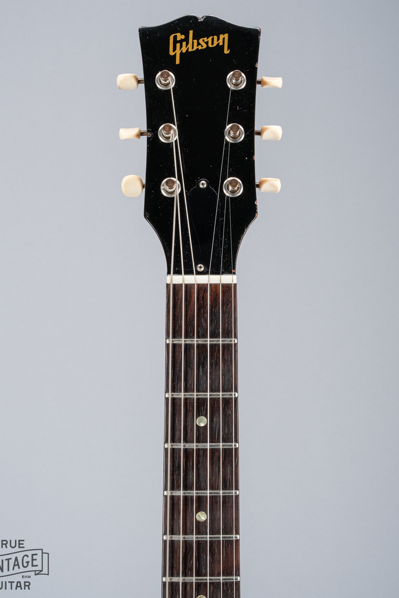 Front of 1964 Gibson SG Junior Cherry guitar neck headstock fretboard original frets tuner buttons Gibson logo nut truss rod cover