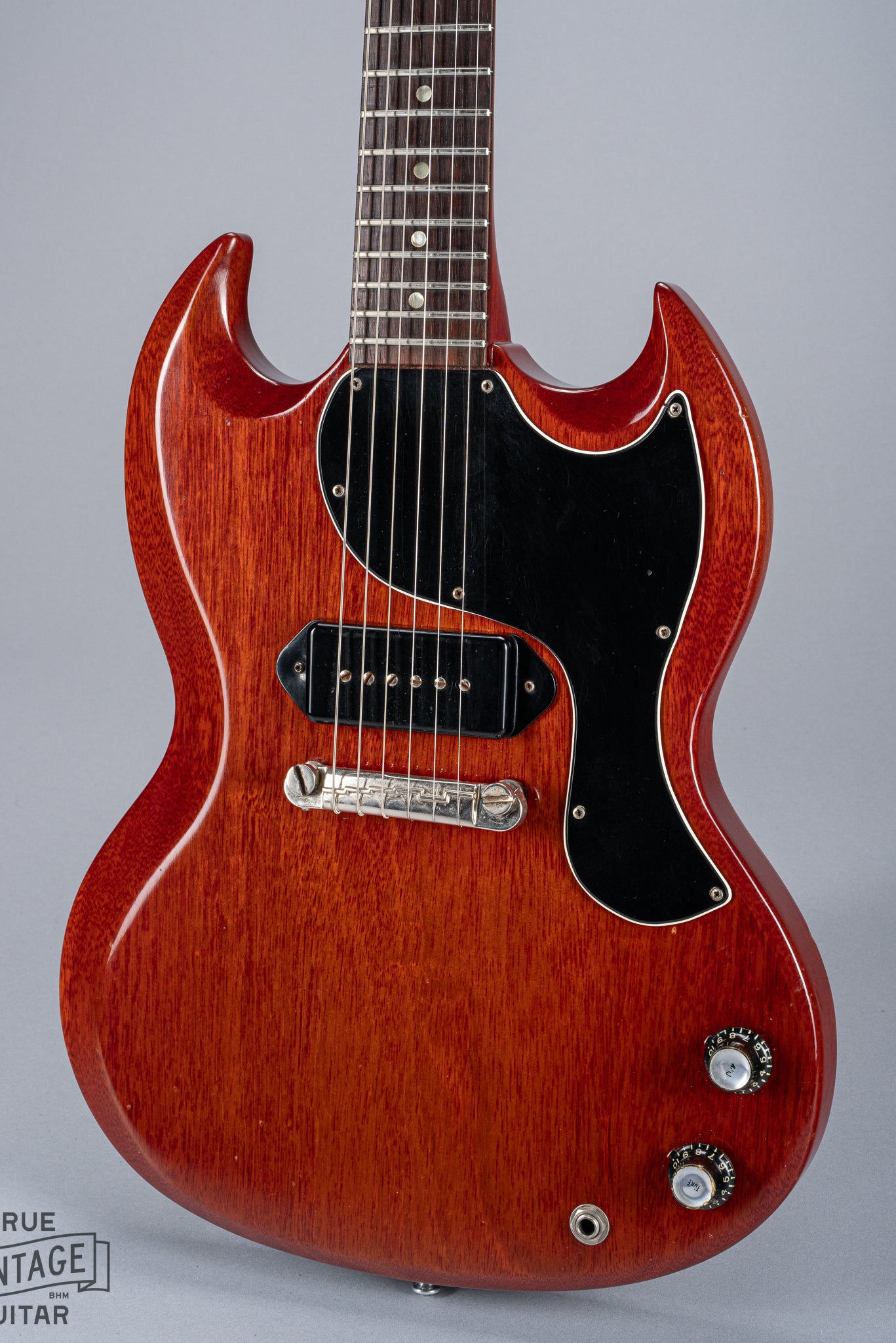Front of 1964 Gibson SG Junior Cherry body pickguard dog ear P90 bridge wrap around tailpiece volume and tone controls fretboard original frets