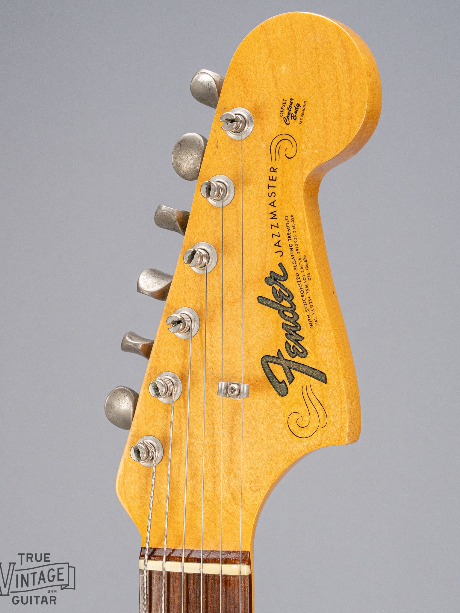 Front of 1965 Fender Jazzmaster sunburst guitar fender logo and tuners