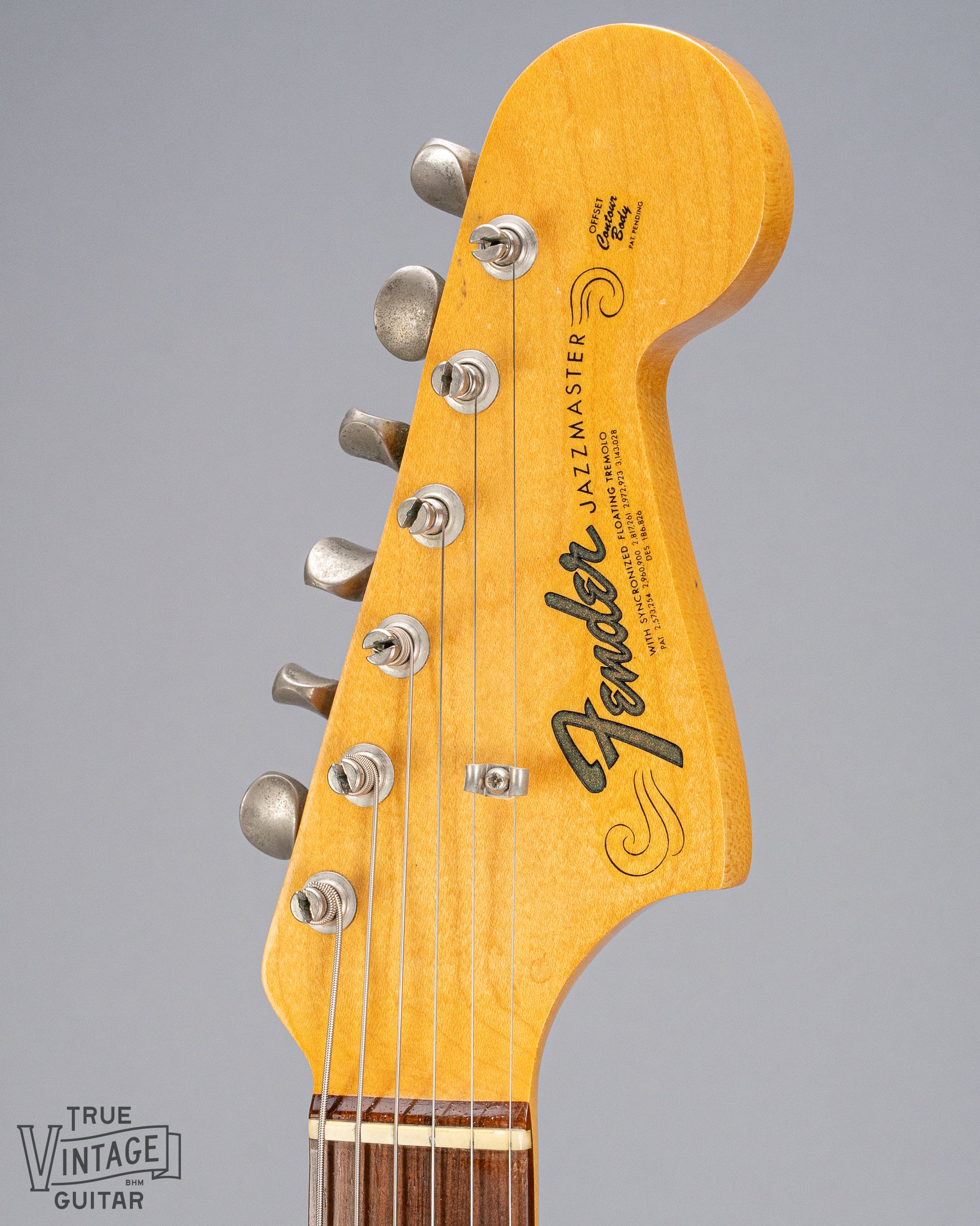 Front of 1965 Fender Jazzmaster sunburst guitar fender logo and tuners