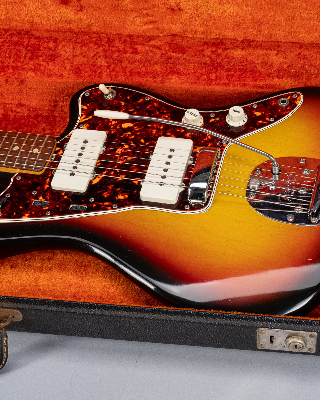 Front of 1965 Fender Jazzmaster sunburst guitar body tortoise shell pickguard in original case