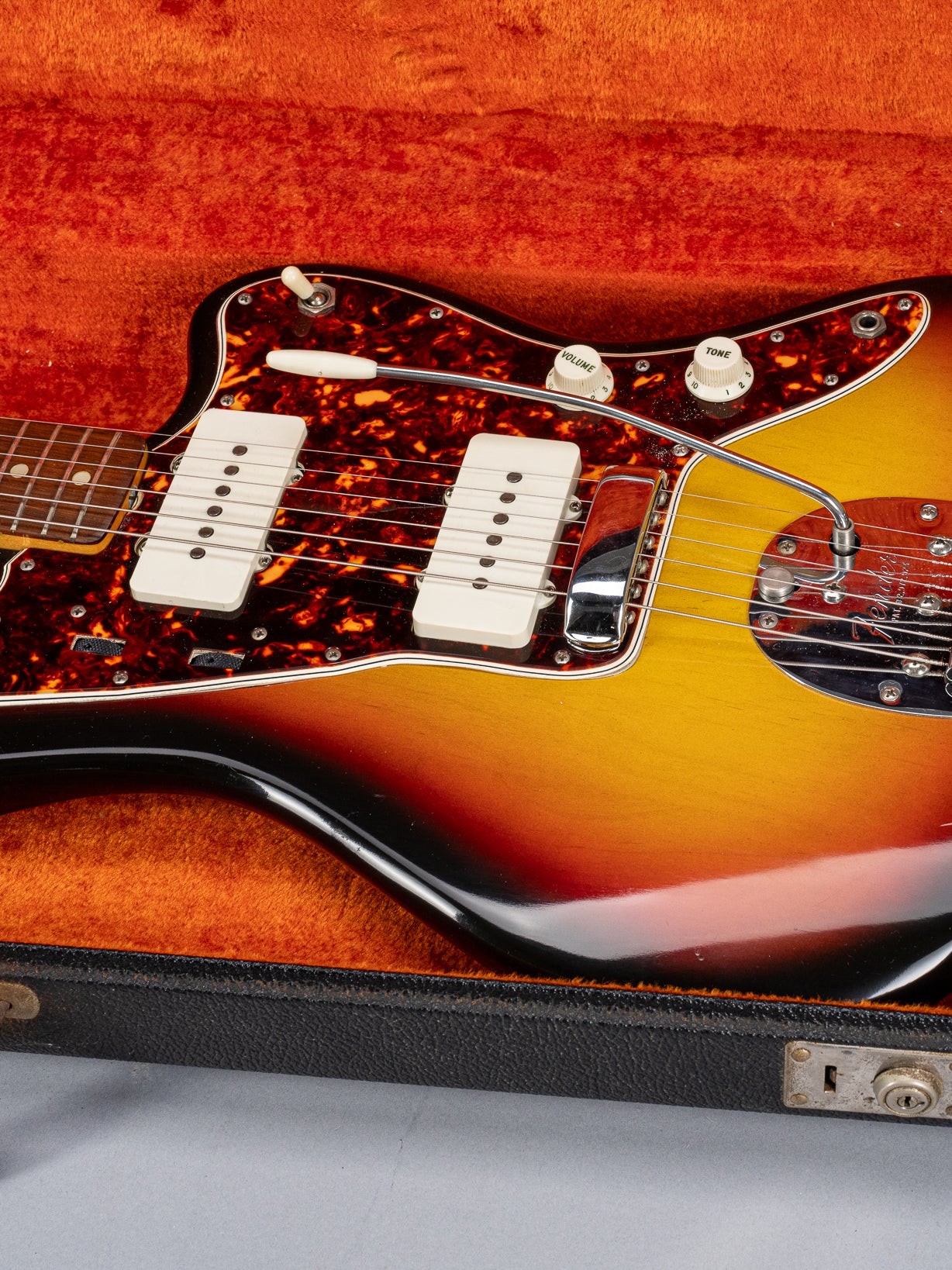 Front of 1965 Fender Jazzmaster sunburst guitar body tortoise shell pickguard in original case