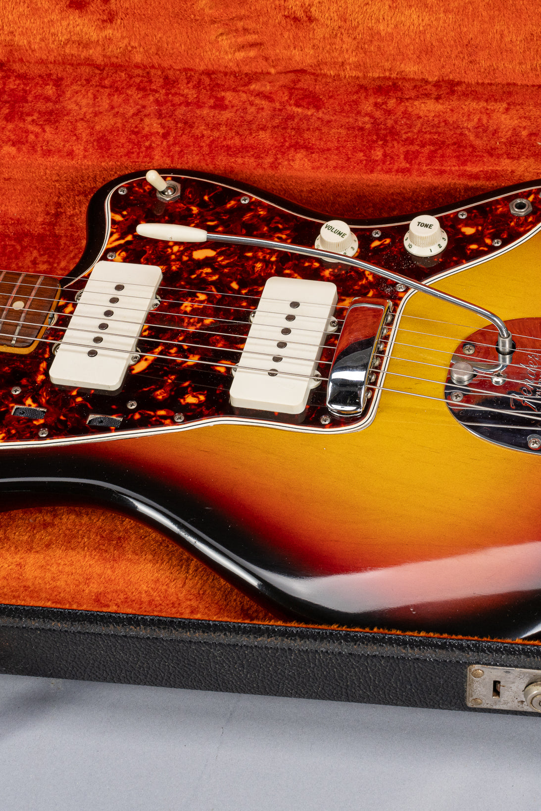 Front of 1965 Fender Jazzmaster sunburst guitar body tortoise shell pickguard in original case