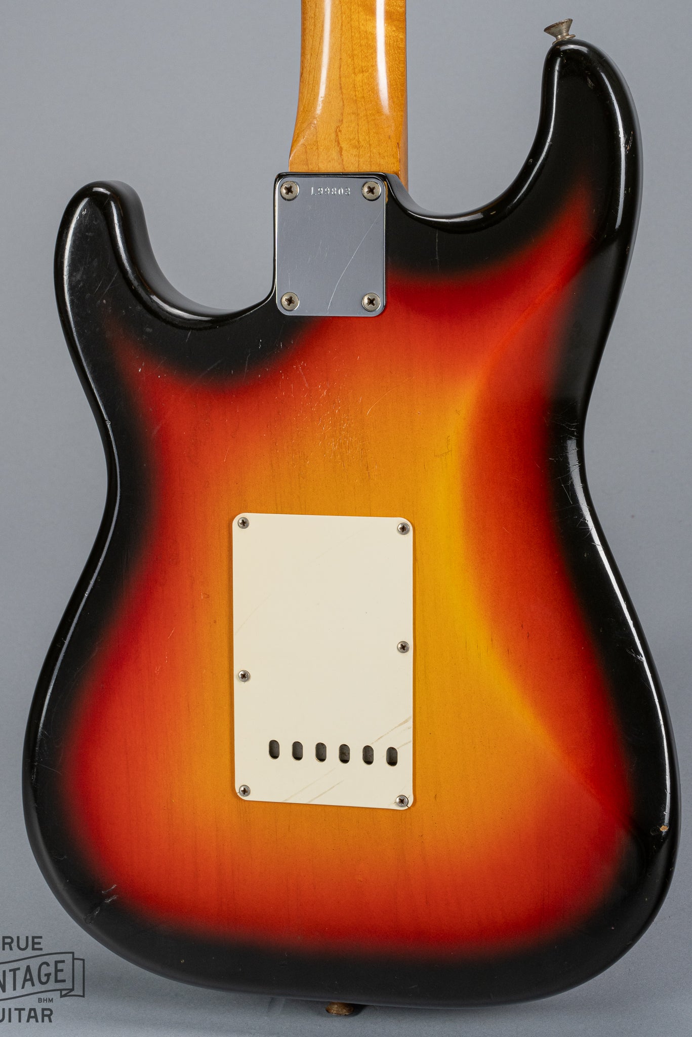 back of 1965 Fender Stratocaster Sunburst guitar body trem plate neck plate