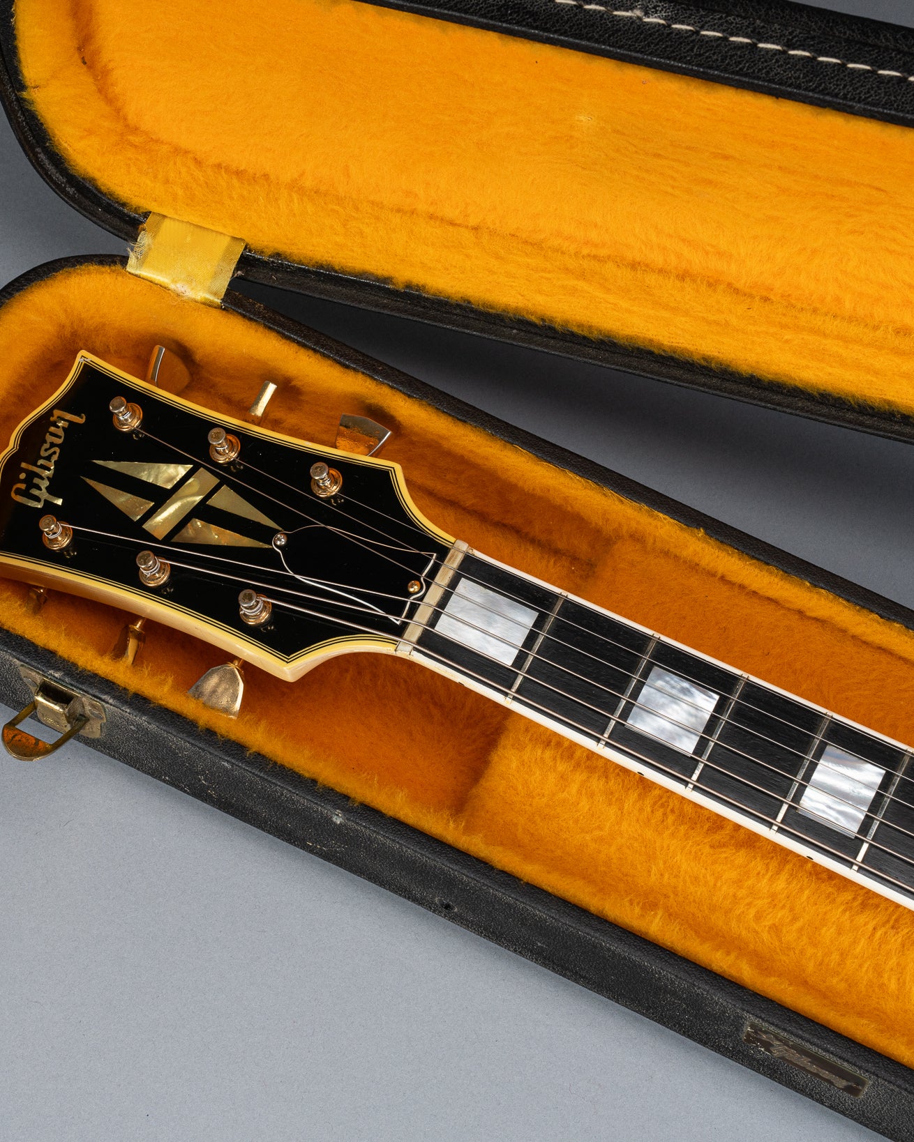 Front of 1965 Gibson SG Custom white guitar three pickup with Bigsby B5 vibrato tailpiece headstock and neck in original case