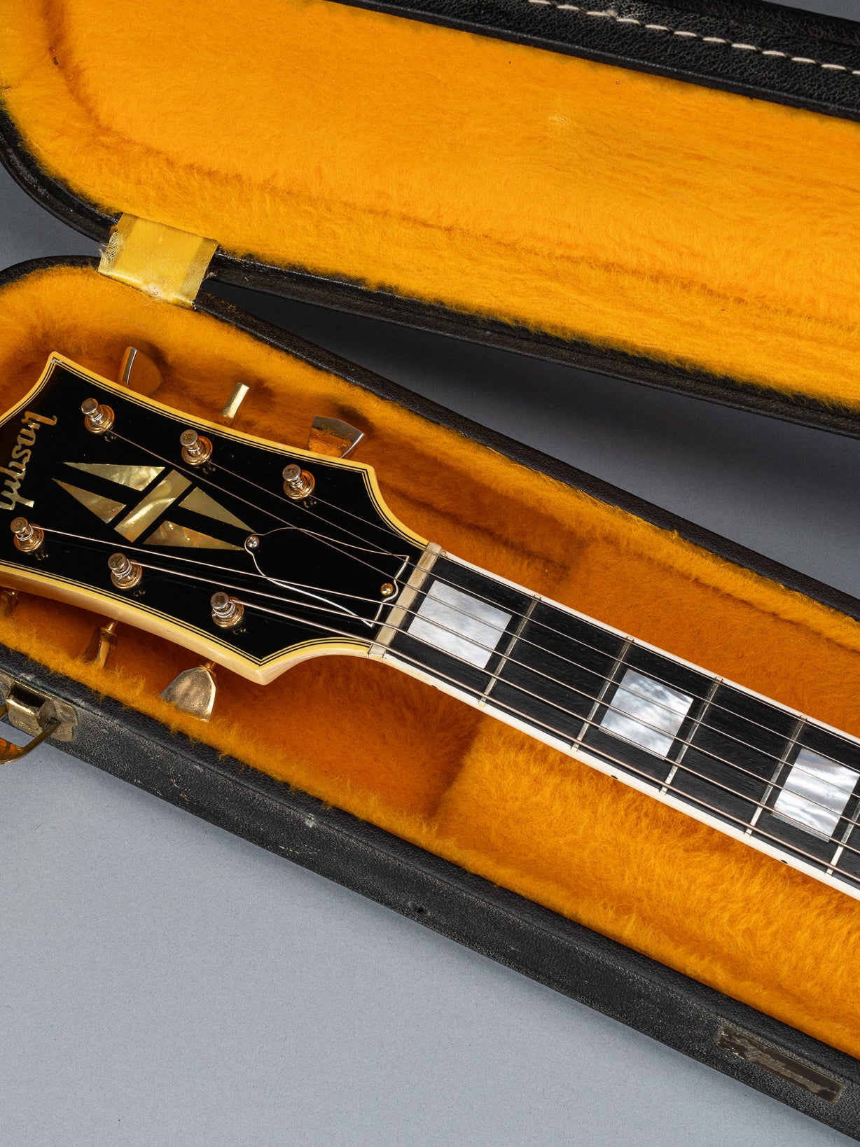 Front of 1965 Gibson SG Custom white guitar three pickup with Bigsby B5 vibrato tailpiece headstock and neck in original case