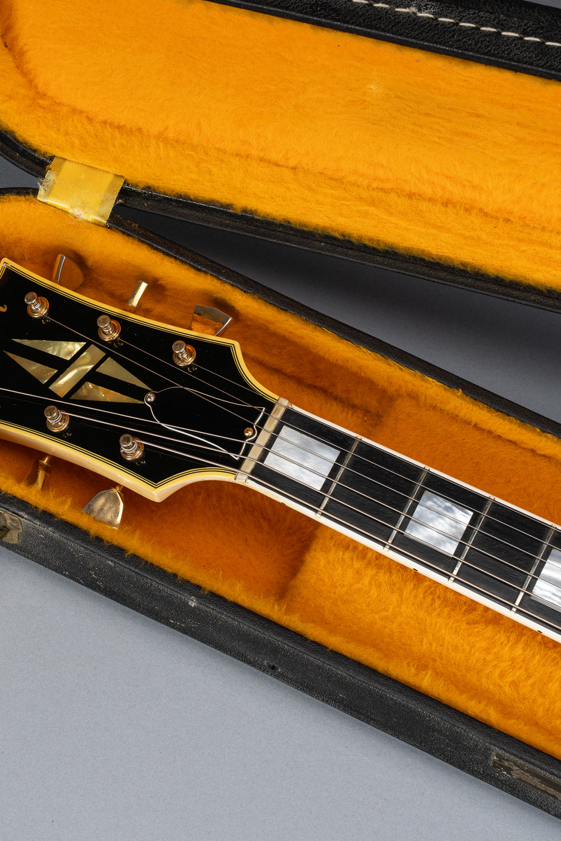 Front of 1965 Gibson SG Custom white guitar three pickup with Bigsby B5 vibrato tailpiece headstock and neck in original case