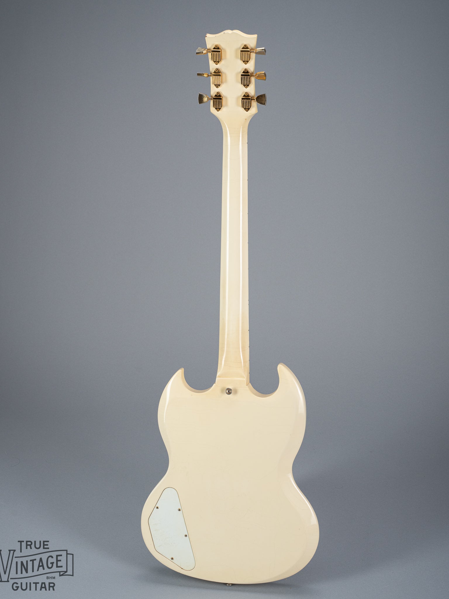 Back of 1965 Gibson SG Custom white guitar three pickup with Bigsby B5 vibrato tailpiece neck headstock tuners control plate